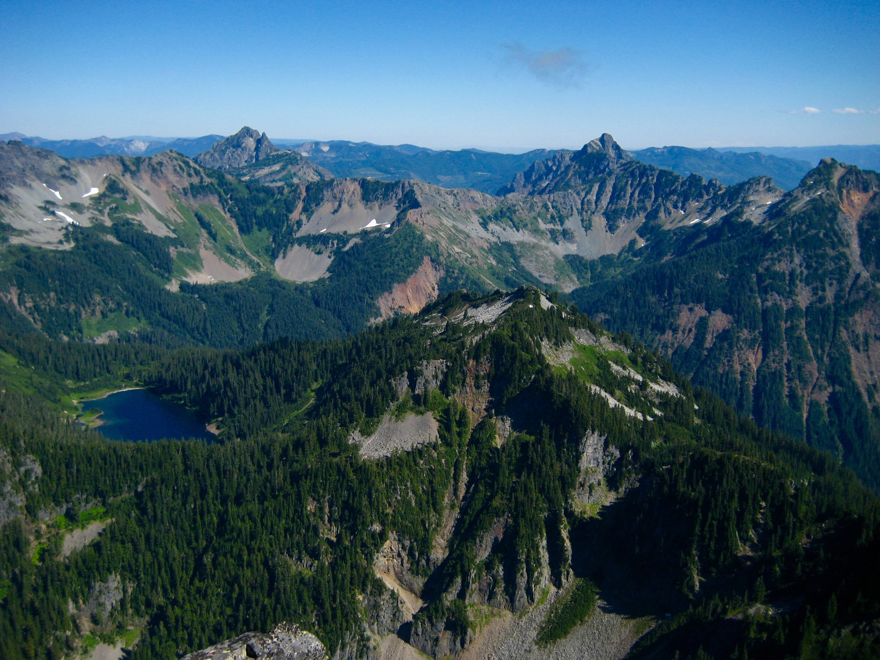 Three Queens, Hibox Peak, and Joe Lake as seen from the summit of Mt Thomson in the Snoqualmie Mountains