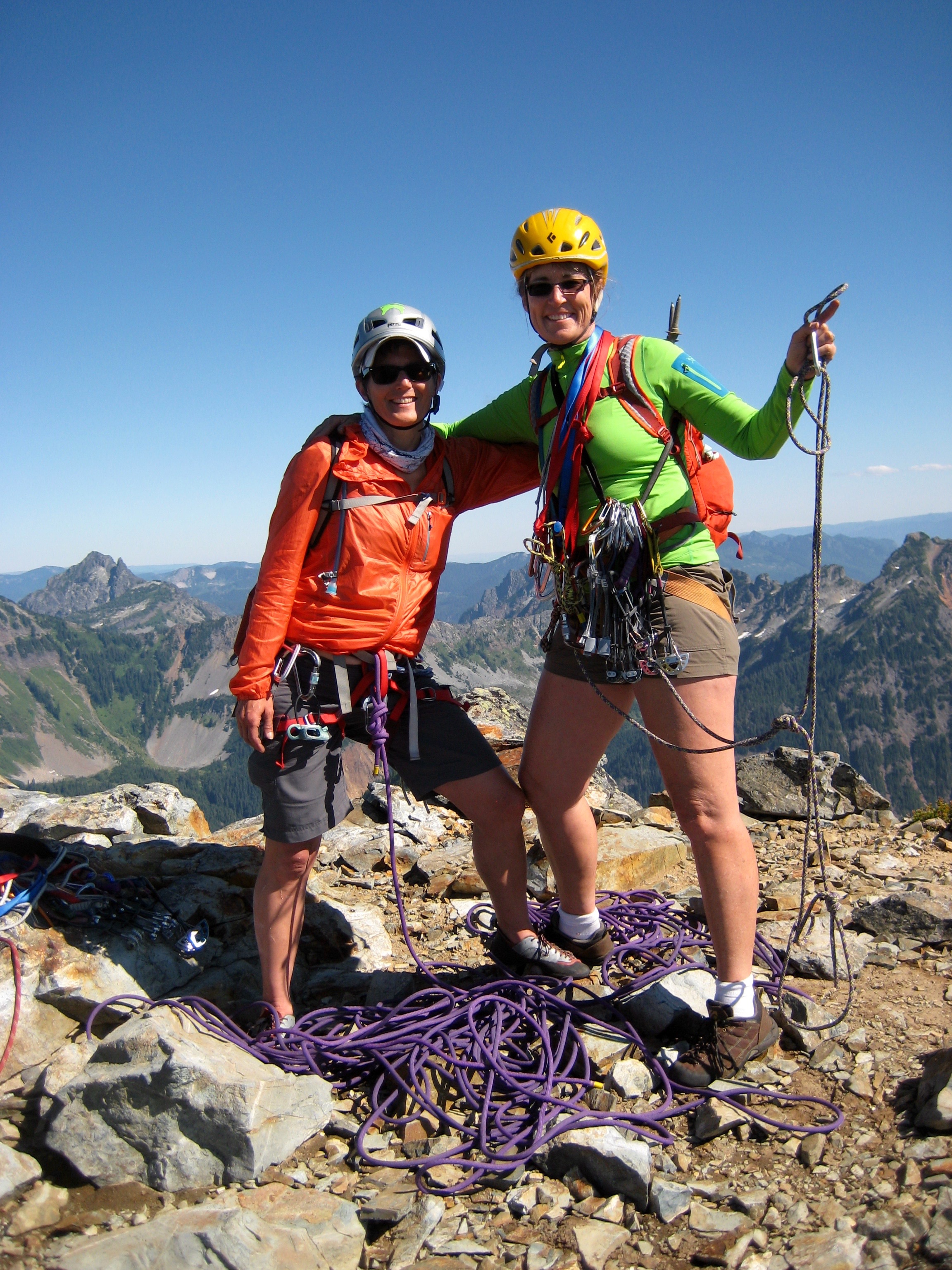 rock climbers celebrating on the flat summit of Mt Thomson in the Snoqualmie Mountains