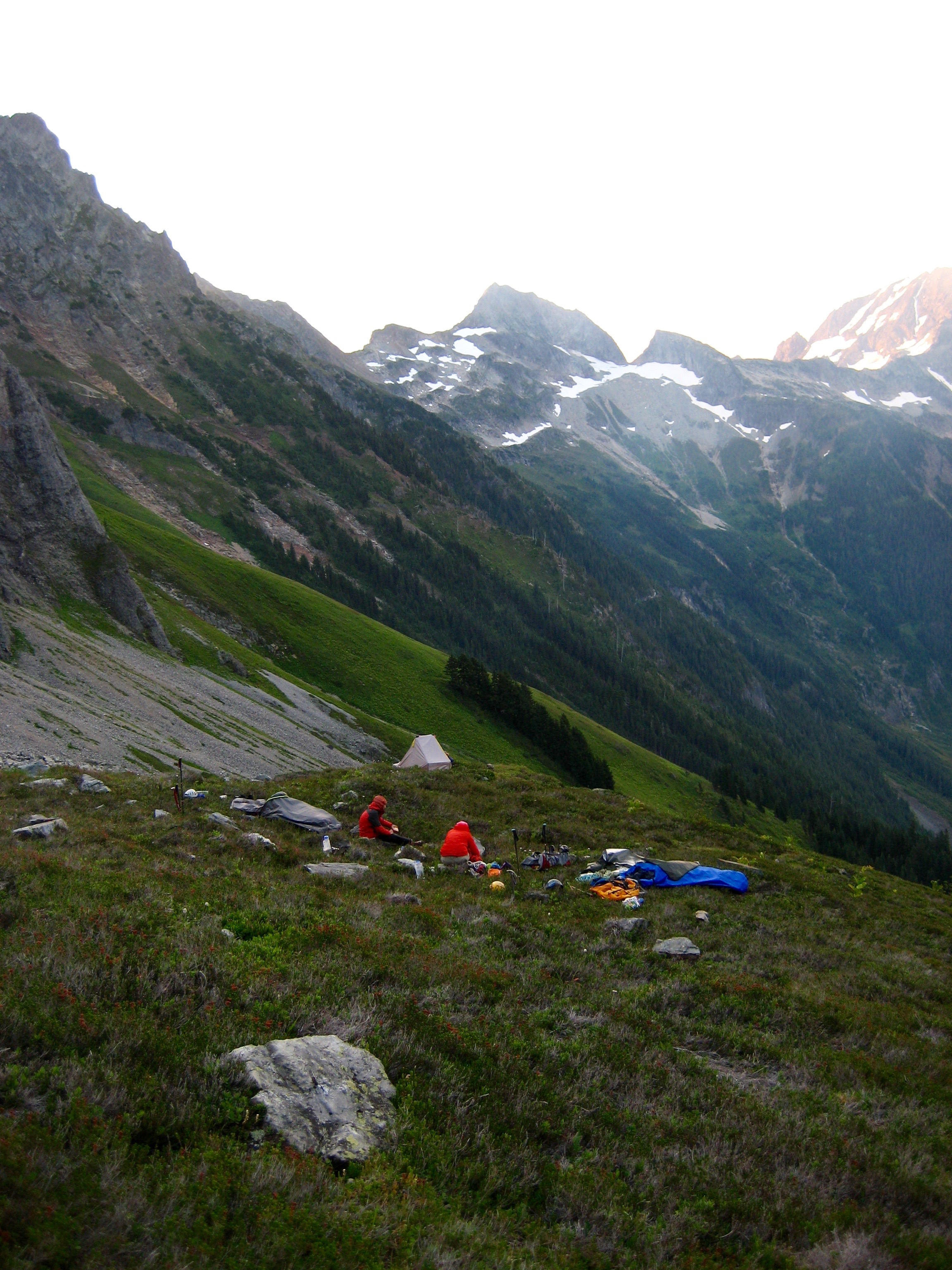 mountain climbers bivey camp in heather field below Johannesburg Mountain with North Cascades mountains in the background