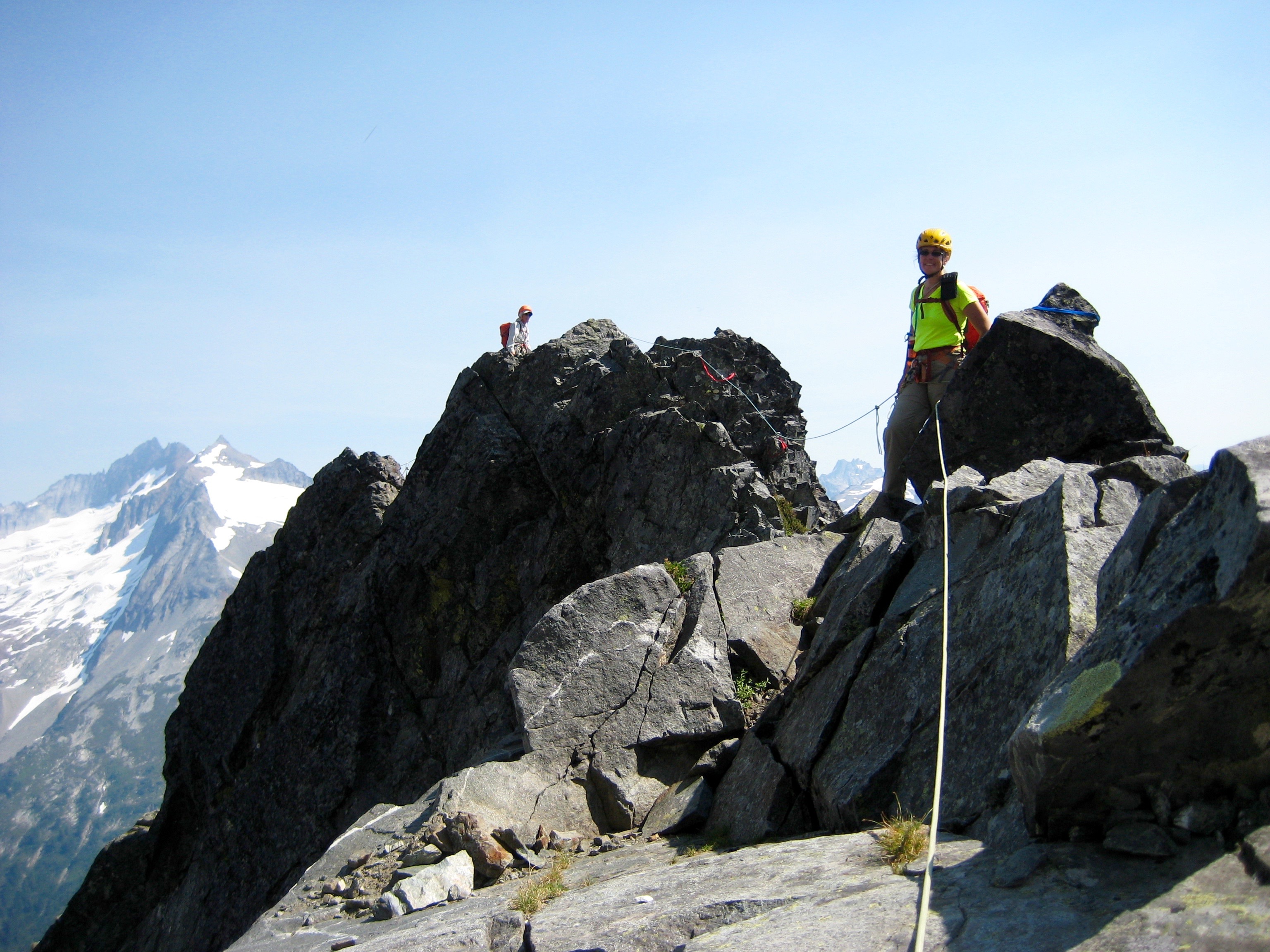roped mountain climbers traversing rock horns on the east ridge of Johannesburg Mountain in North Cascades National Park