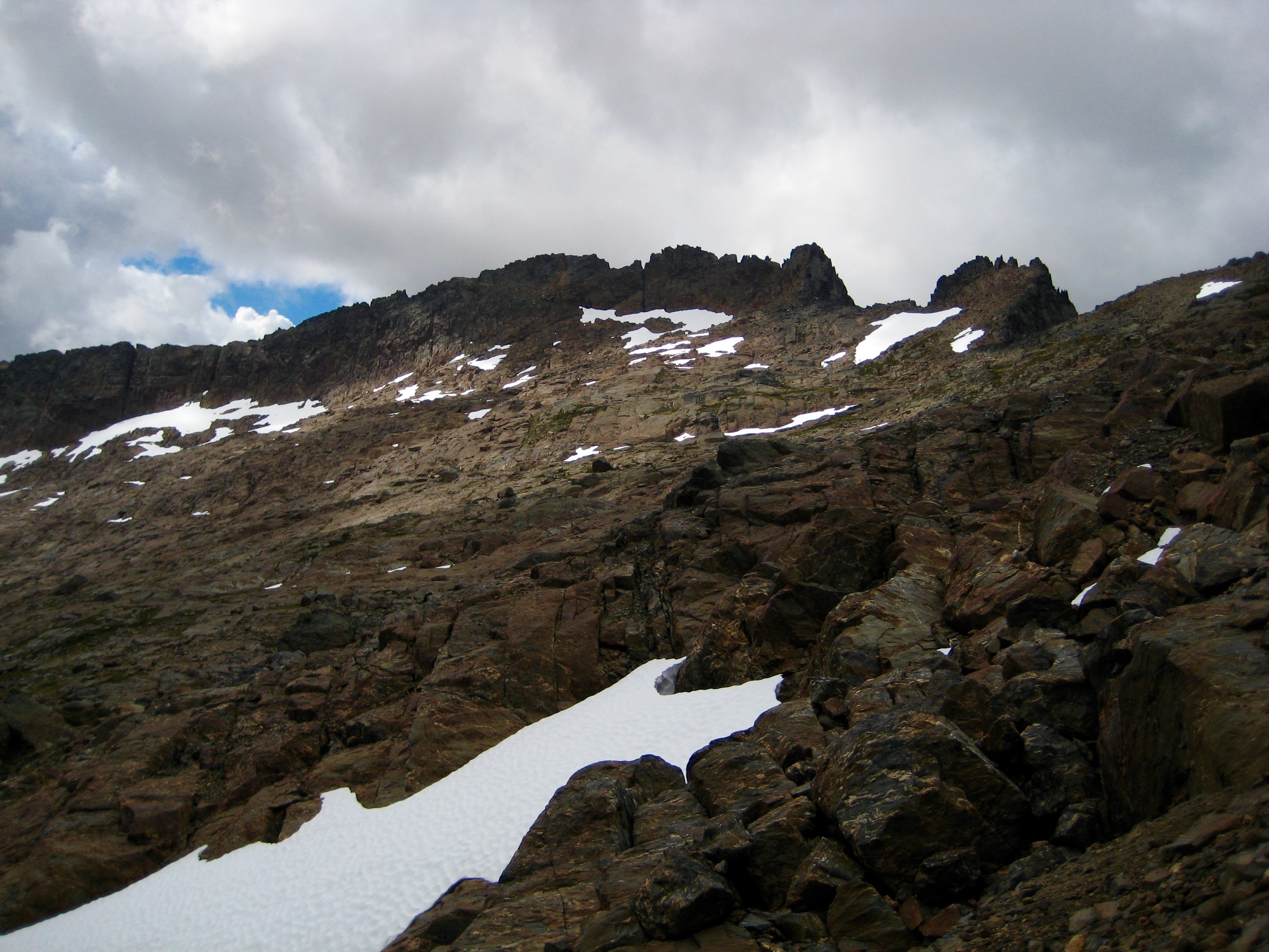 Looking up the rocky hillside at the summit of Big Chiwaukum Peak in the Alpine Lakes WIlderness from the Cup Lake Saddle along the Chiwaukum Traverse