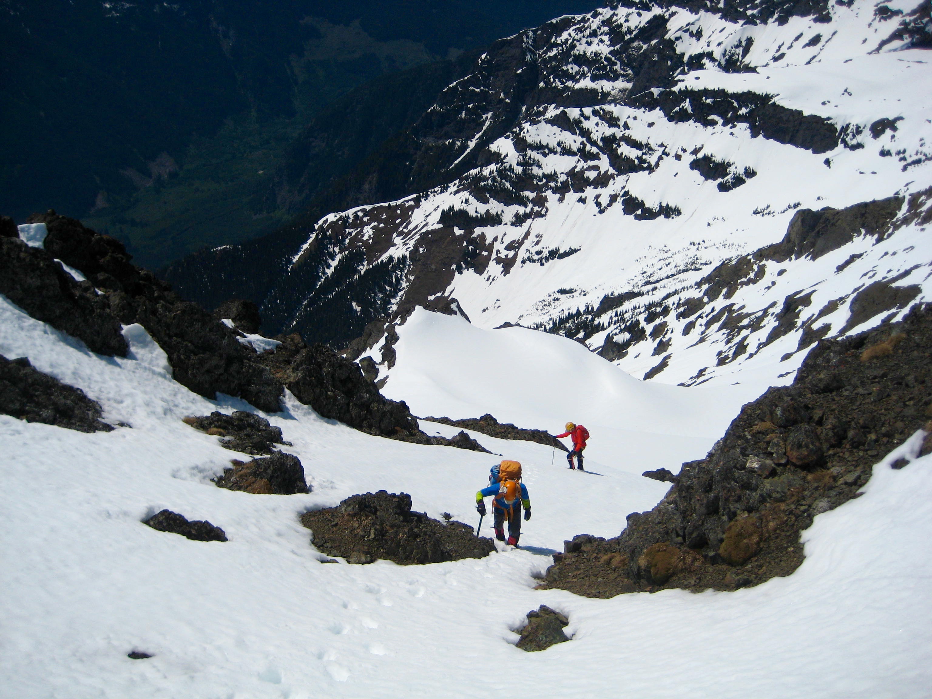 mountain climbers booting up final snow chute near the summit of Silvertip Mountain in the Sumallo Mountains BC Canada