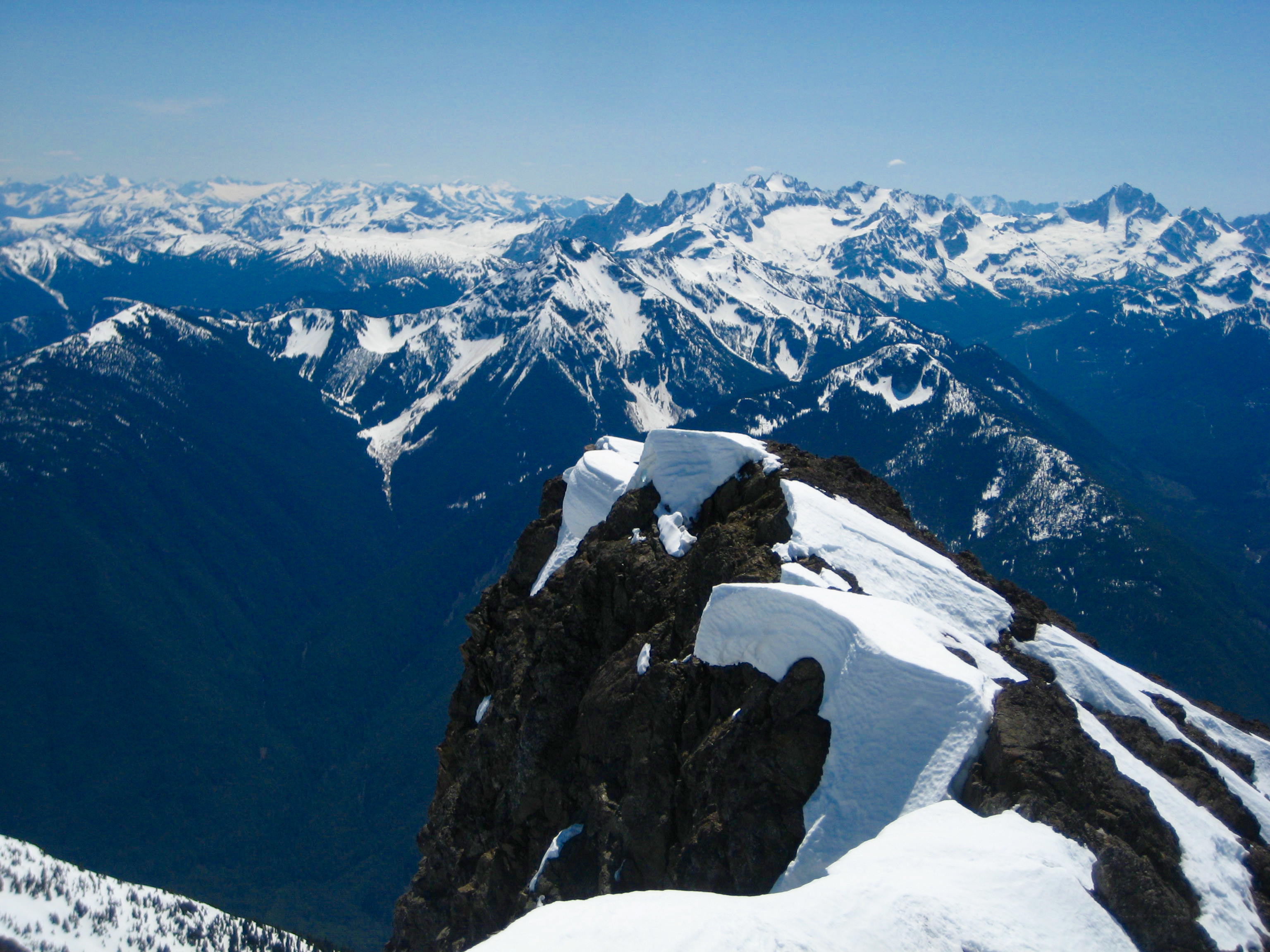 American Chilliwack Mountains in the distance with a rocky horn on the summit of Silvertip Mountain in the Sumallo Mountains BC Canada