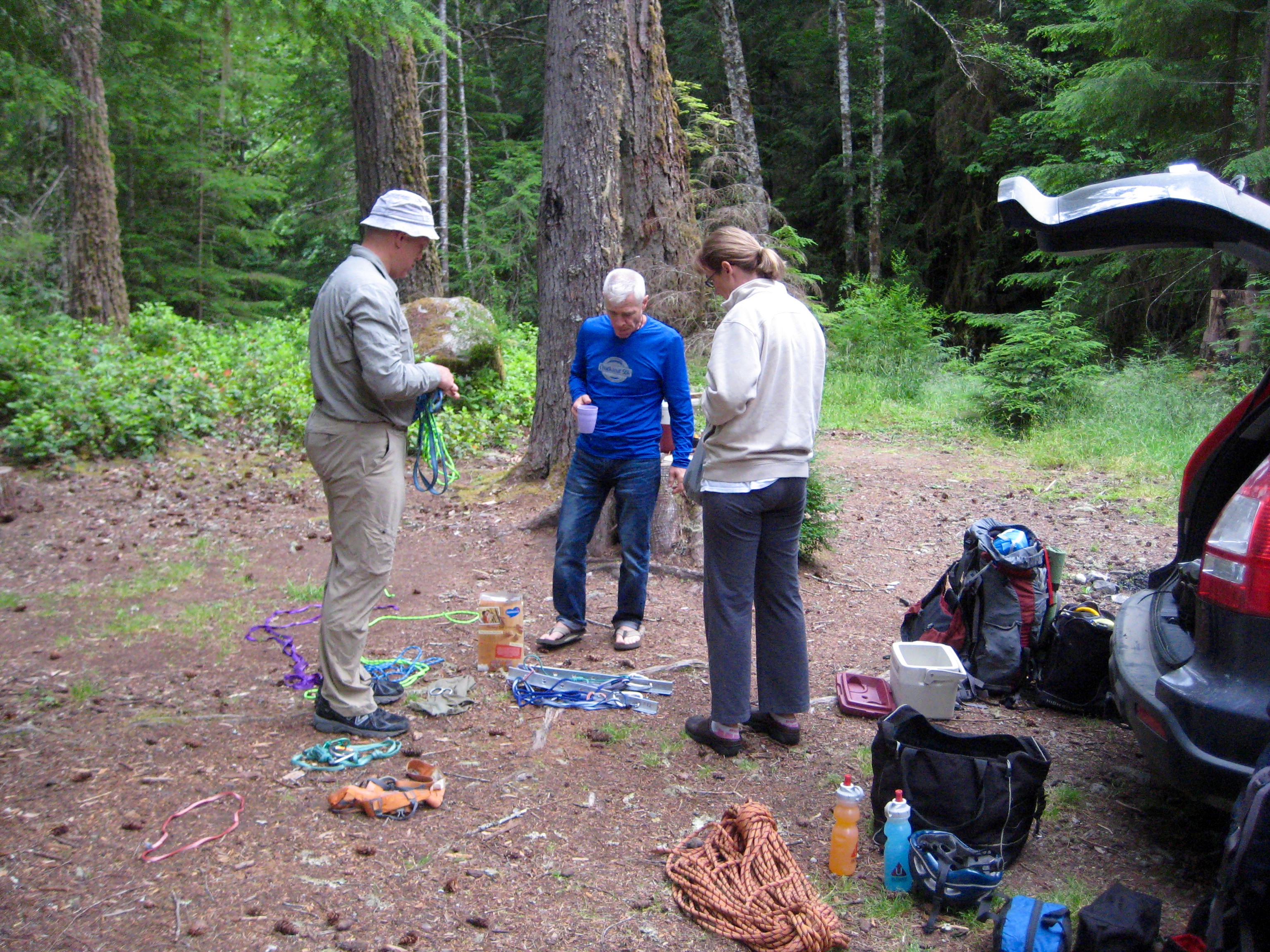 mountain climbers sorting climbing gear in the parking lot before heading out to Gunsight Peak in the Glacier Peak Wilderness