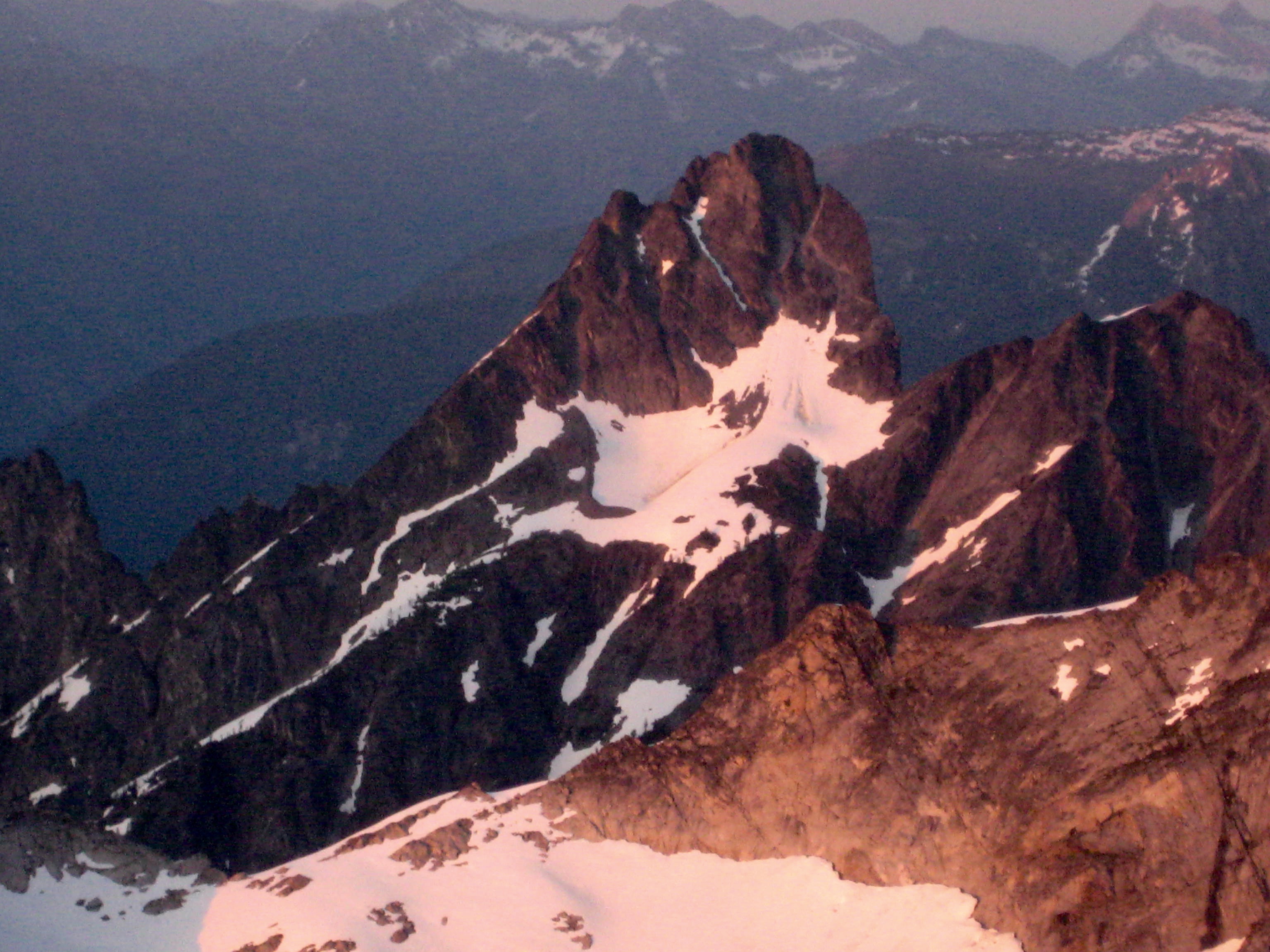 sunset alpenglow on Agnes Mountain in the Glacier Peak Wilderness as seen from Chikamin-Dome Col in the Ptarmigan Mountains