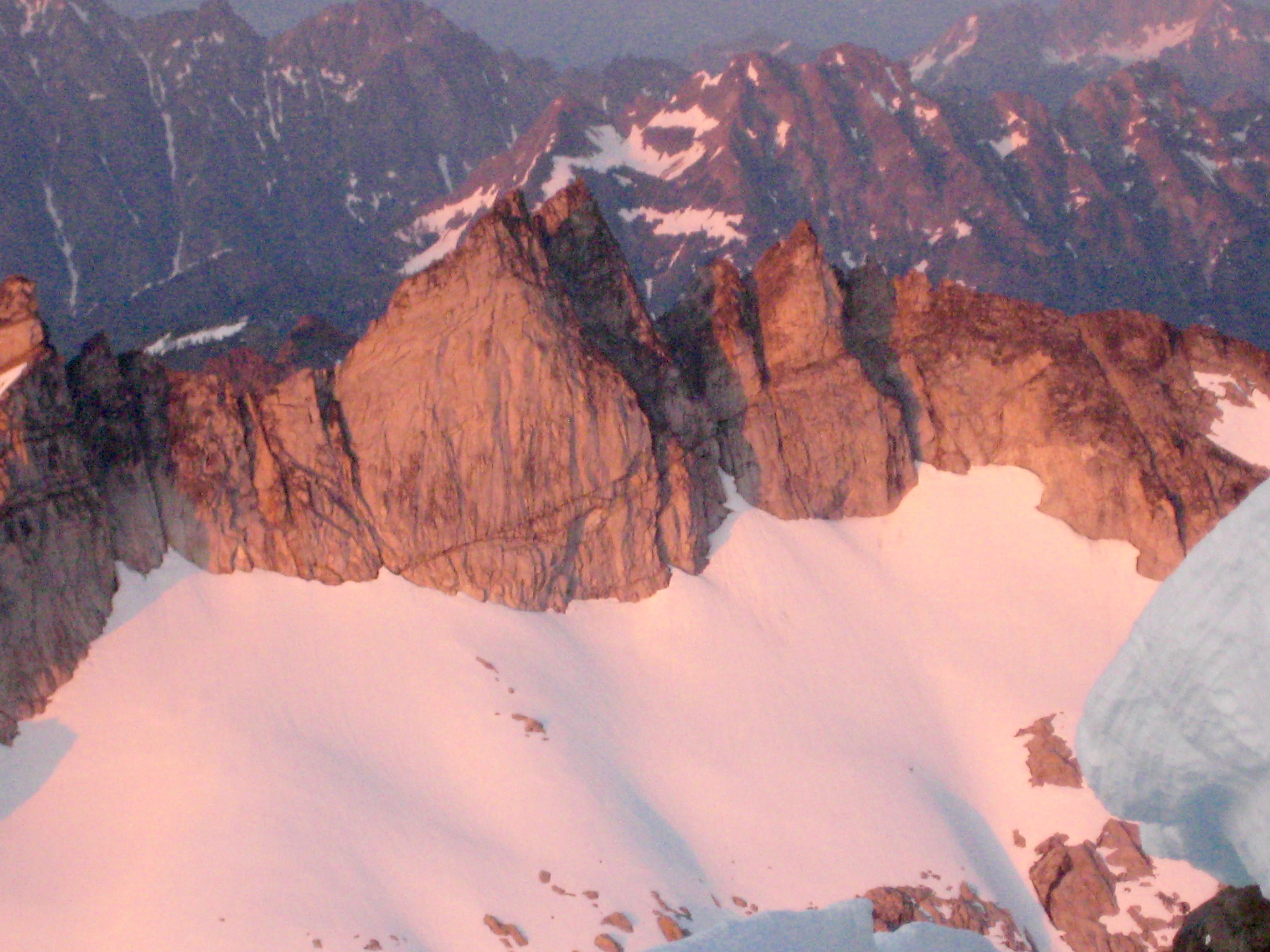 sunset alpenglow on Gunsight Peak in the Glacier Peak Wilderness as seen from climber's camp at Chikamin-Dome Col