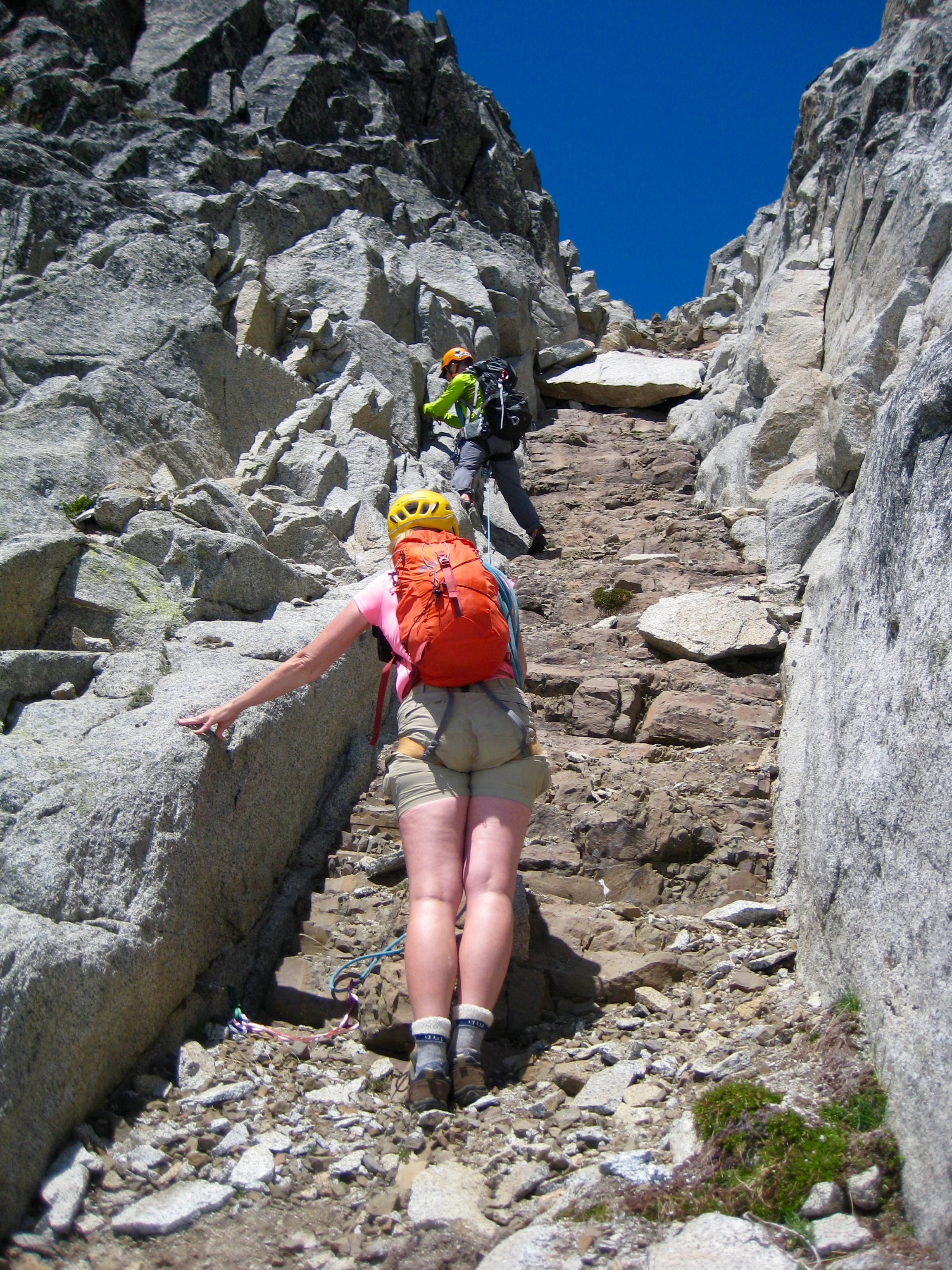 mountain climbers in a deep Basalt Dike on Gunsight Peak in the Glacier Peak WIlderness