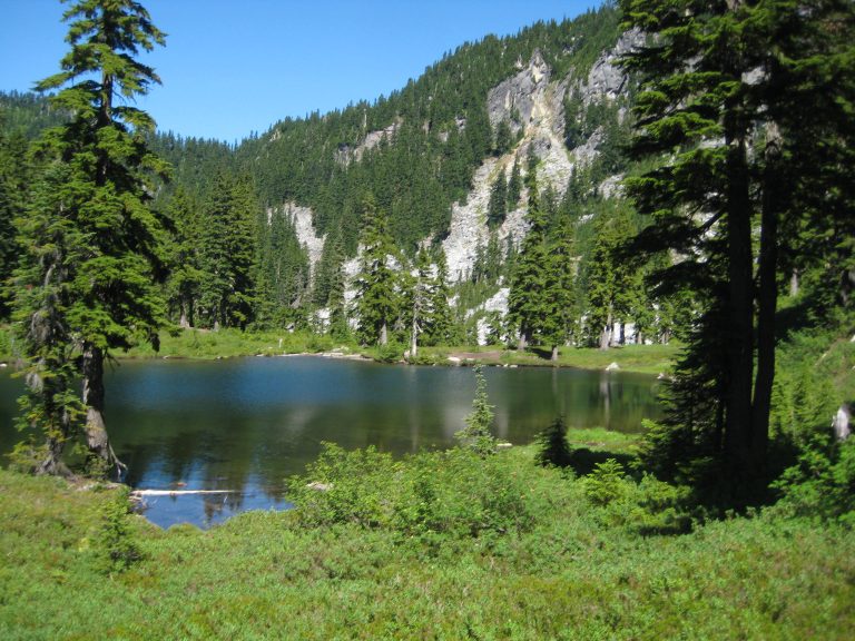 Pretty Fortune Pond sits in a grassy bowl below Fortune Mountain