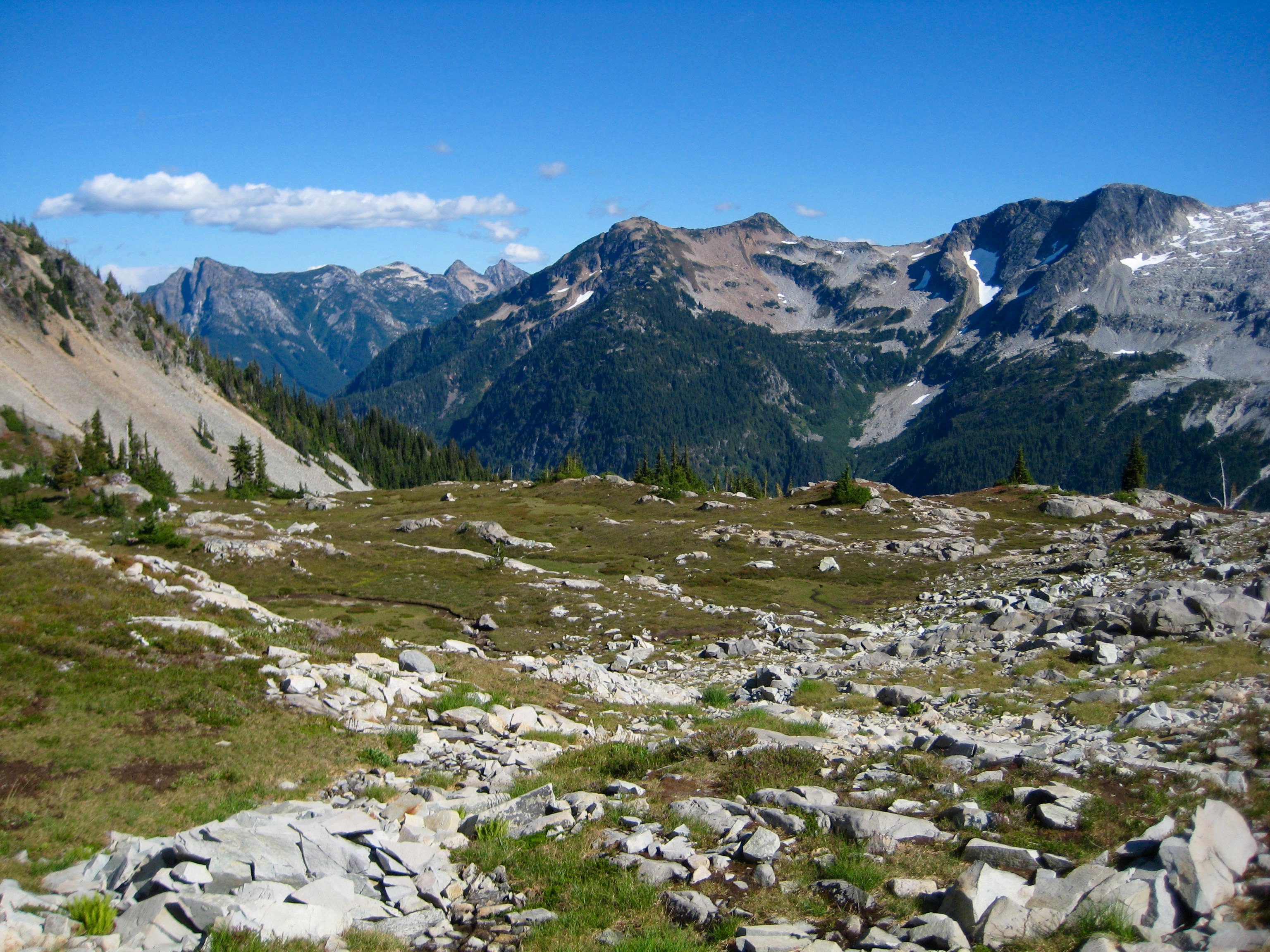 Middle Lakes high meadows platuea with granite boulders in the American Chilliwack Mountains