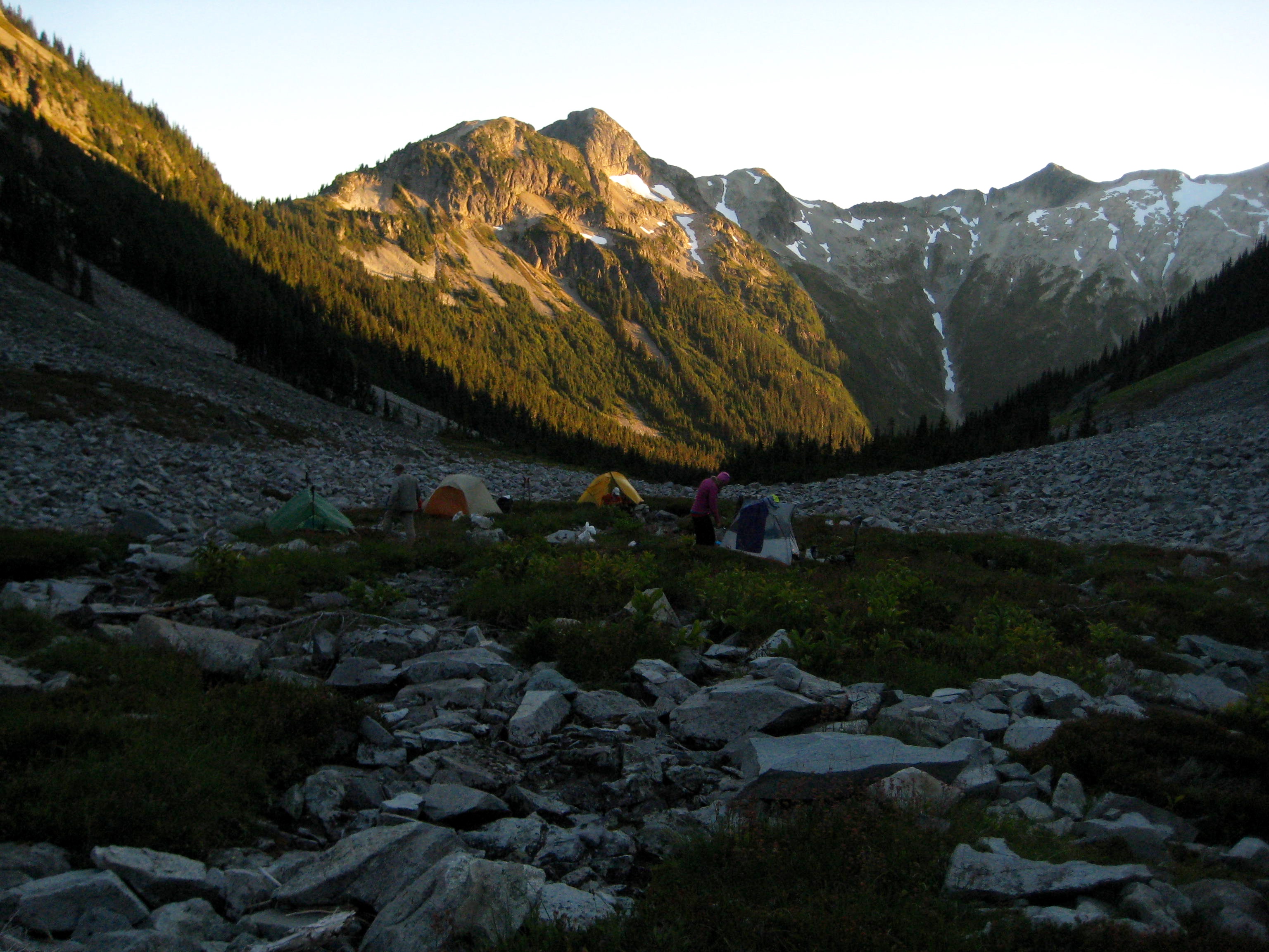 evening light on climbers camp in Indian Basin with granite boulders