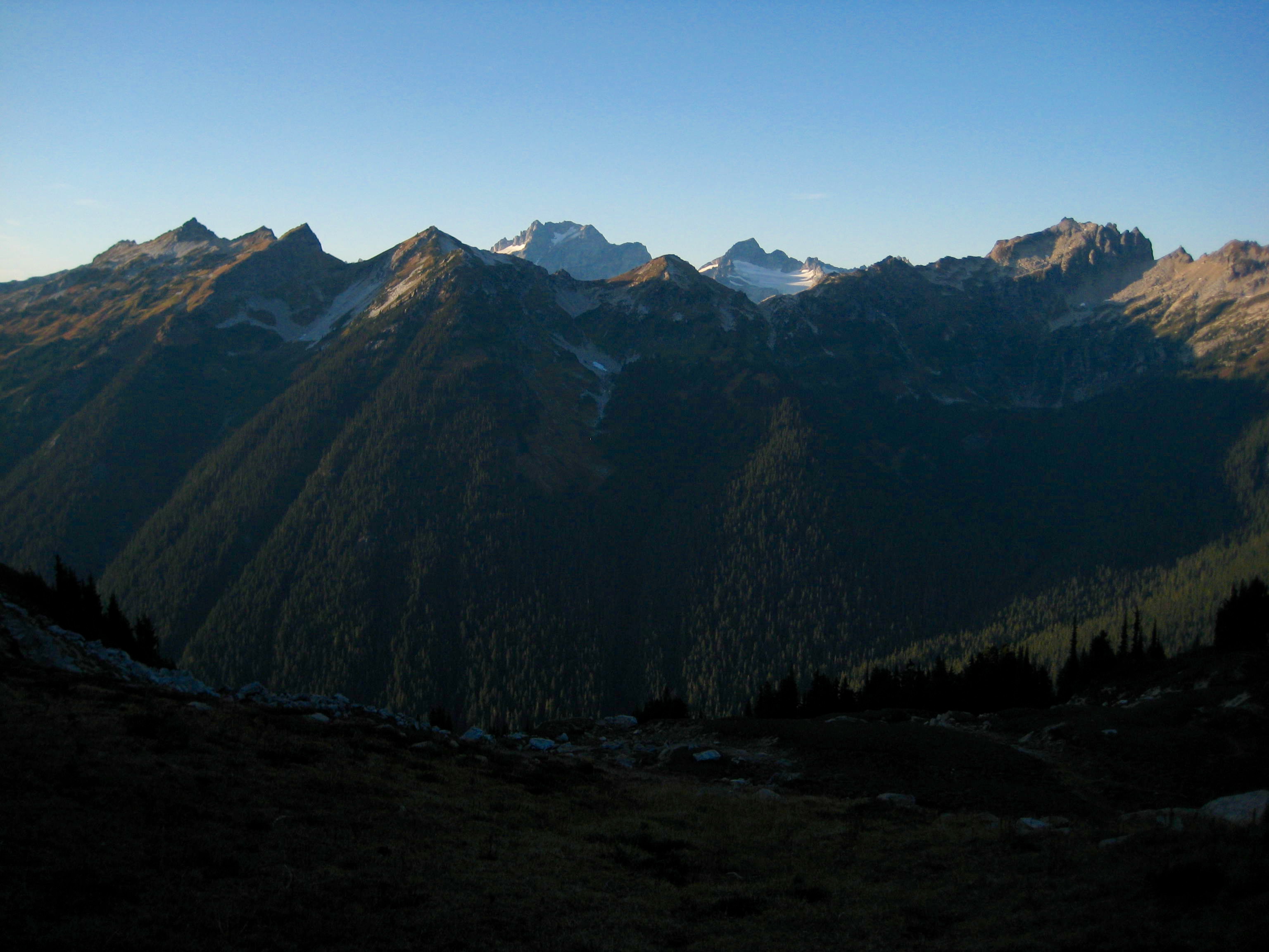 Dome Peak and Sinister Peak above valley floor as seen from Miners Pass n the Glacier Peak Wilderness