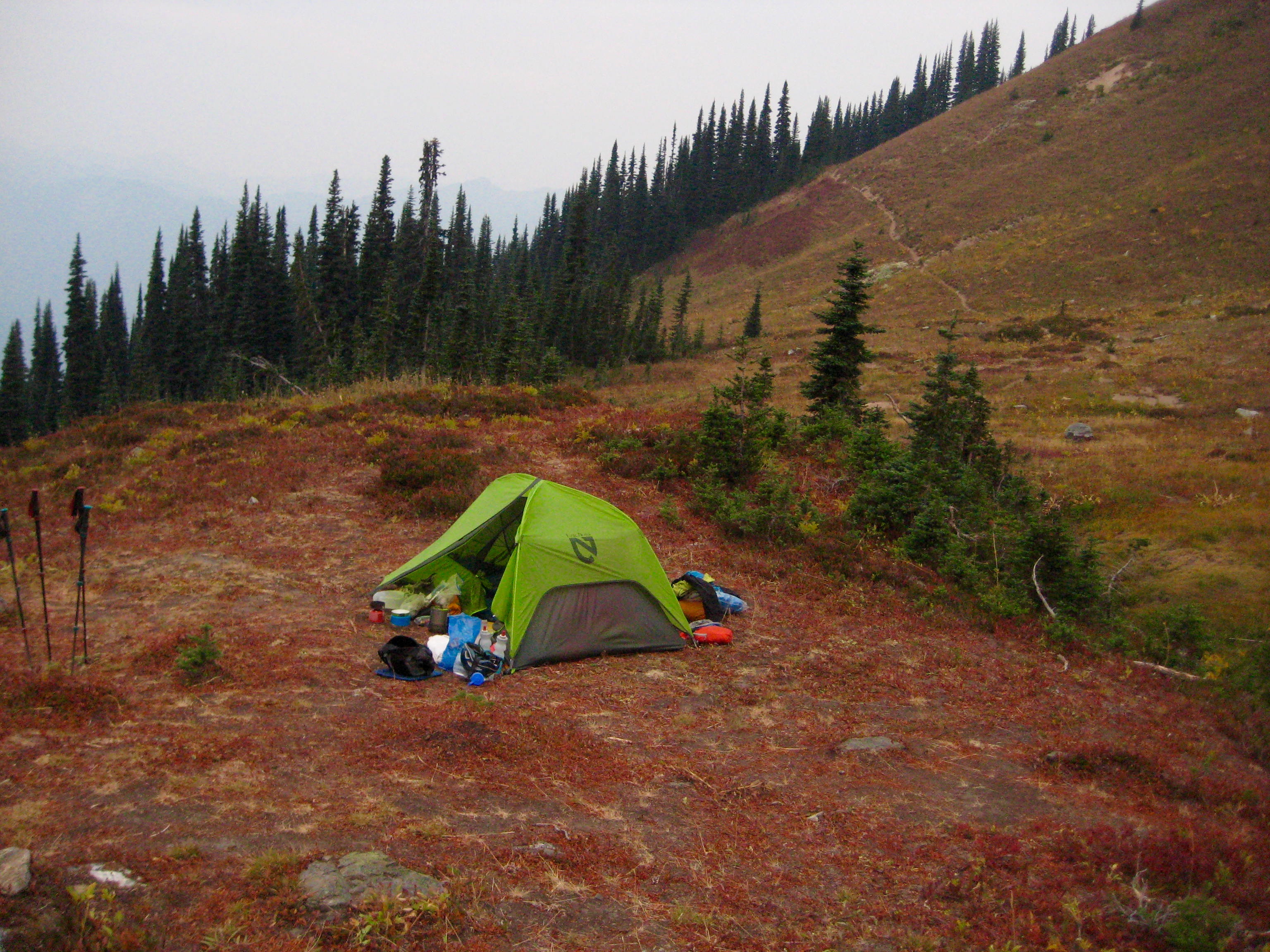 mountain climber camp at Lady Camp in the Glacier Peak Wilderness with fall colored heather slopes