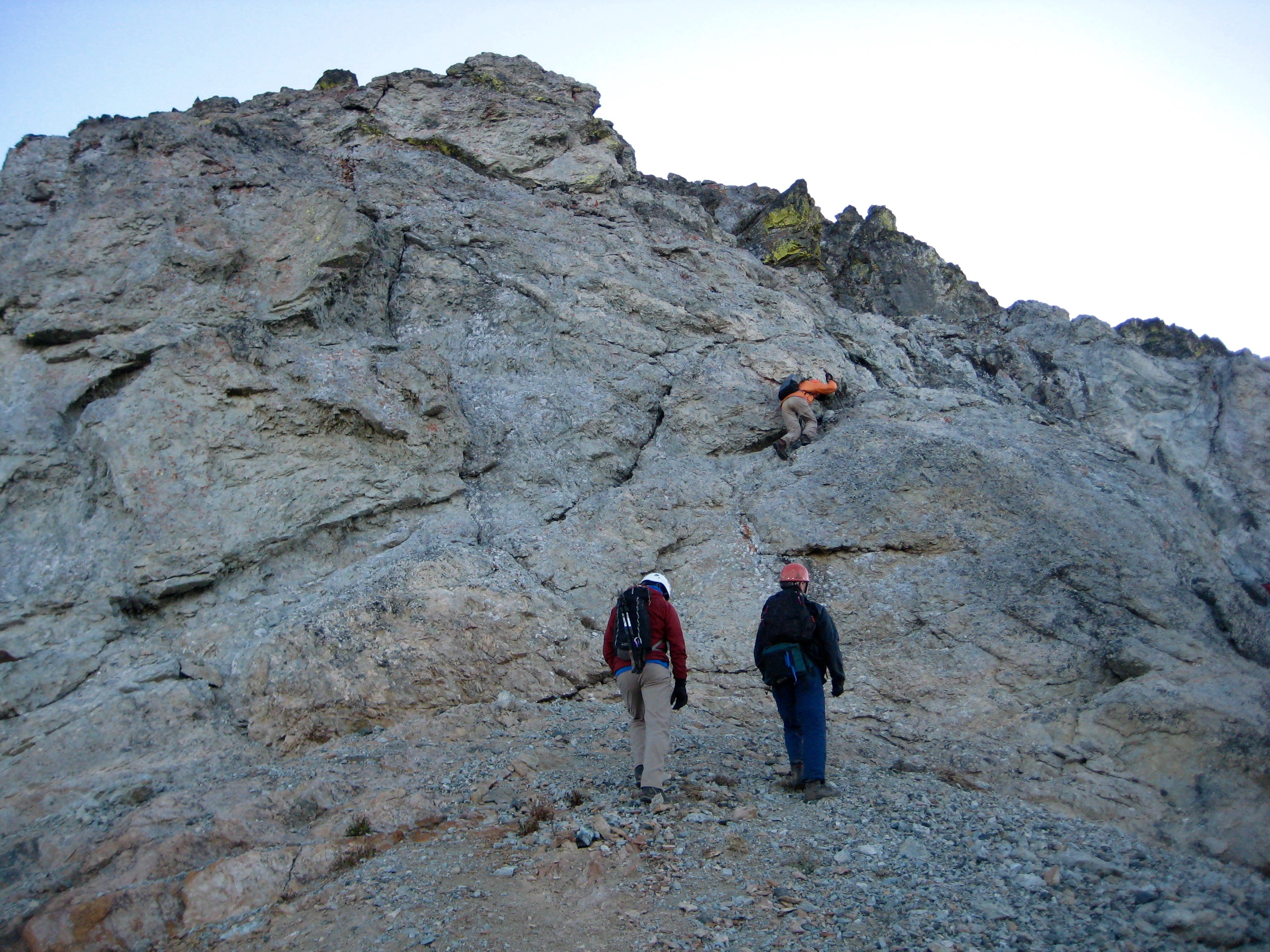 mountain climbers scrambling the rock on the northwest ridge of Seven-Fingered Jack