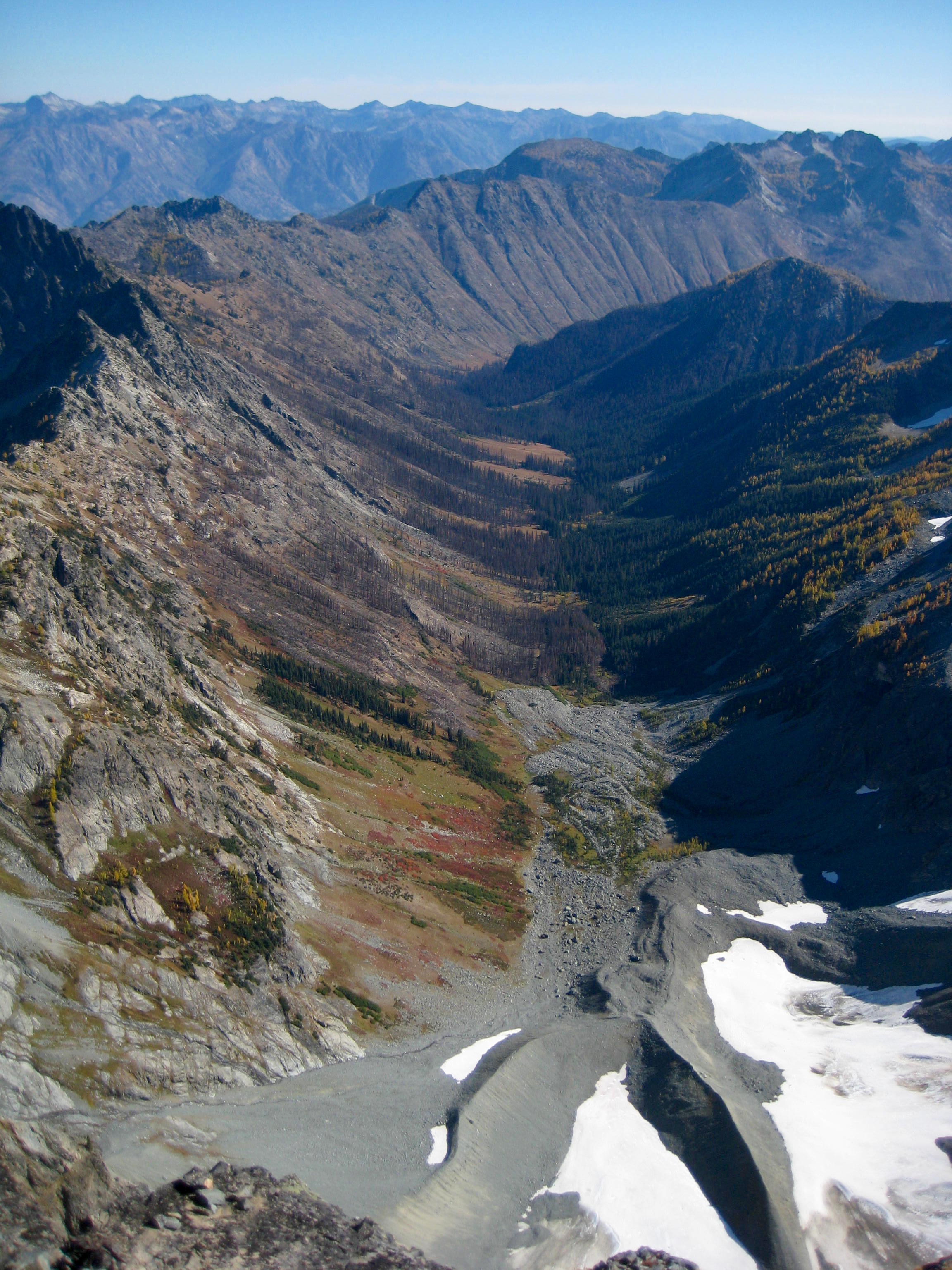 looking down on the fall colored Entiat meadows from the summit of Seven-Fingered Jack