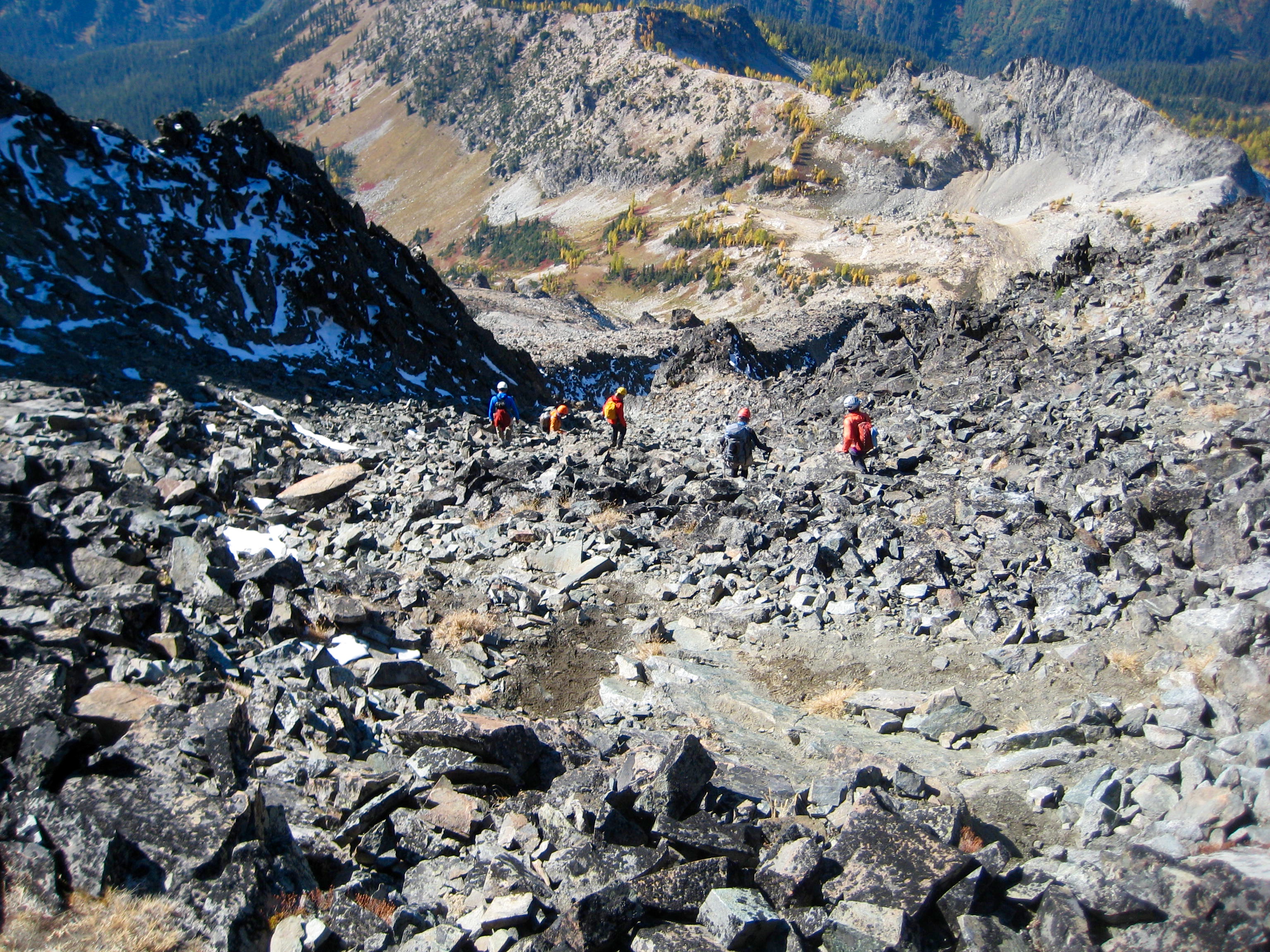 mountain climbers descending the rocky slopes of Seven-Fingered Jack in the Entiat Mountains