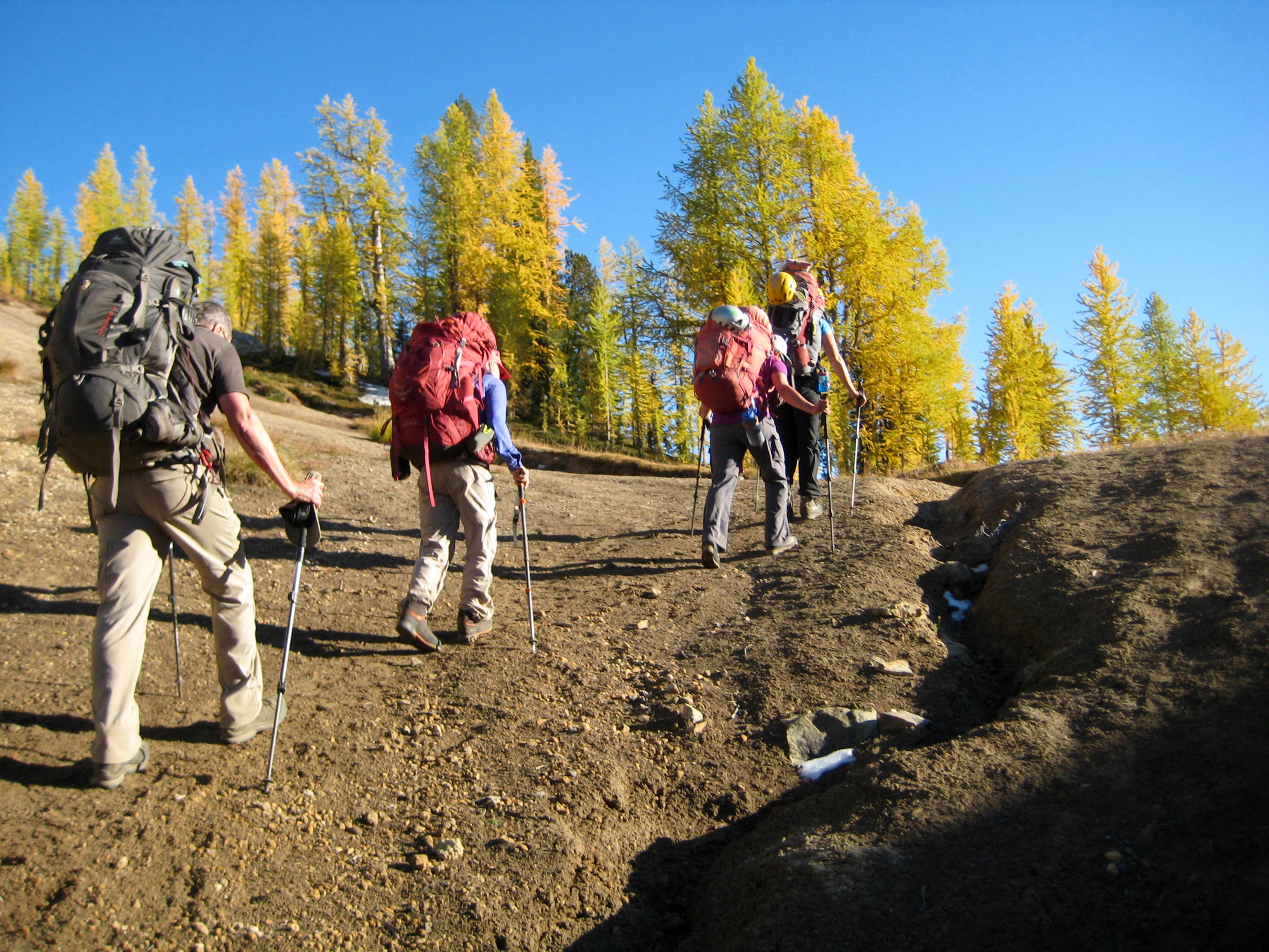 mountain climbers hiking over Leroy Pass in the fall colors