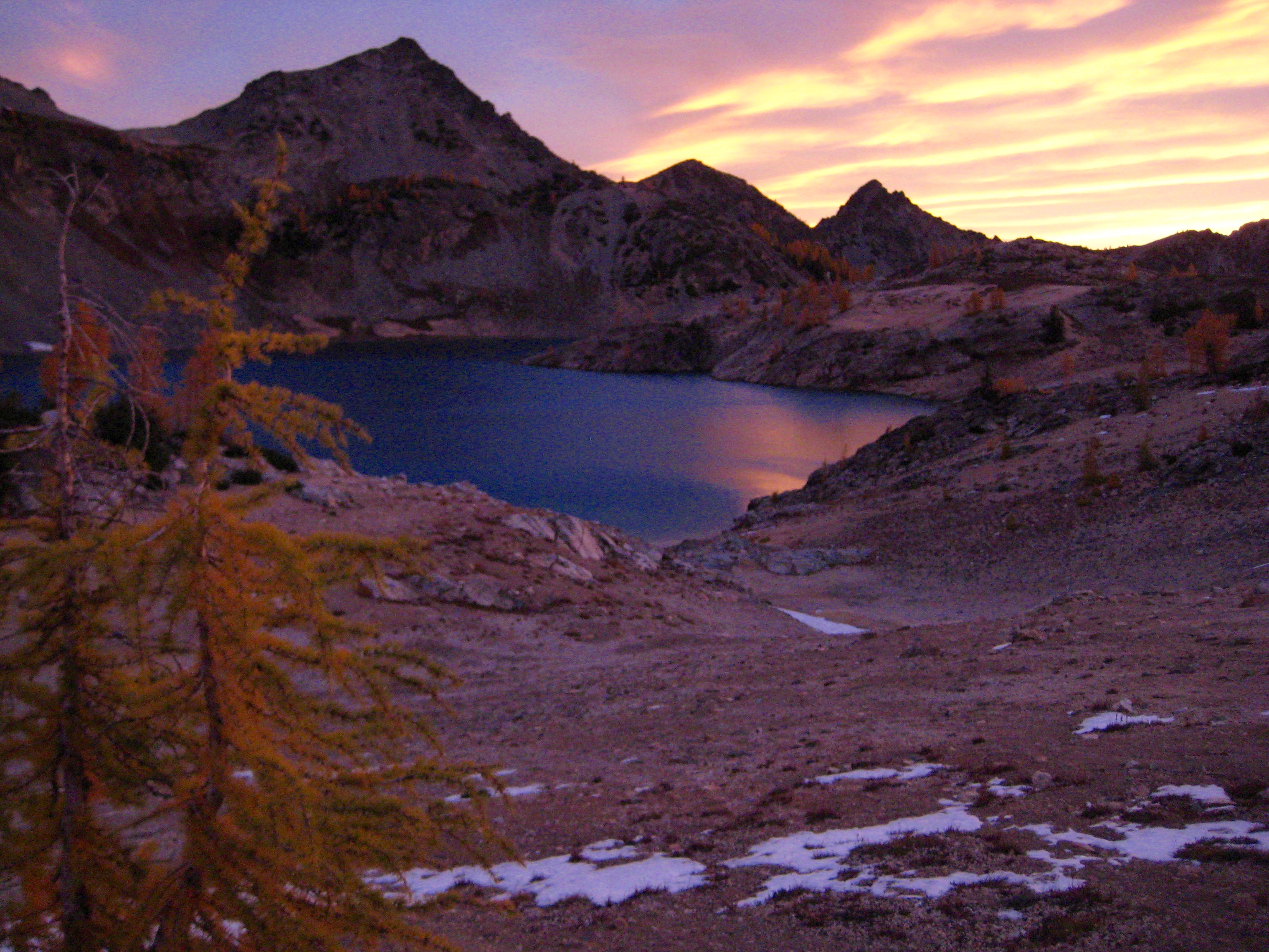 morning light with golden larch trees at Upper Ice Lakes in the Entait Mountains