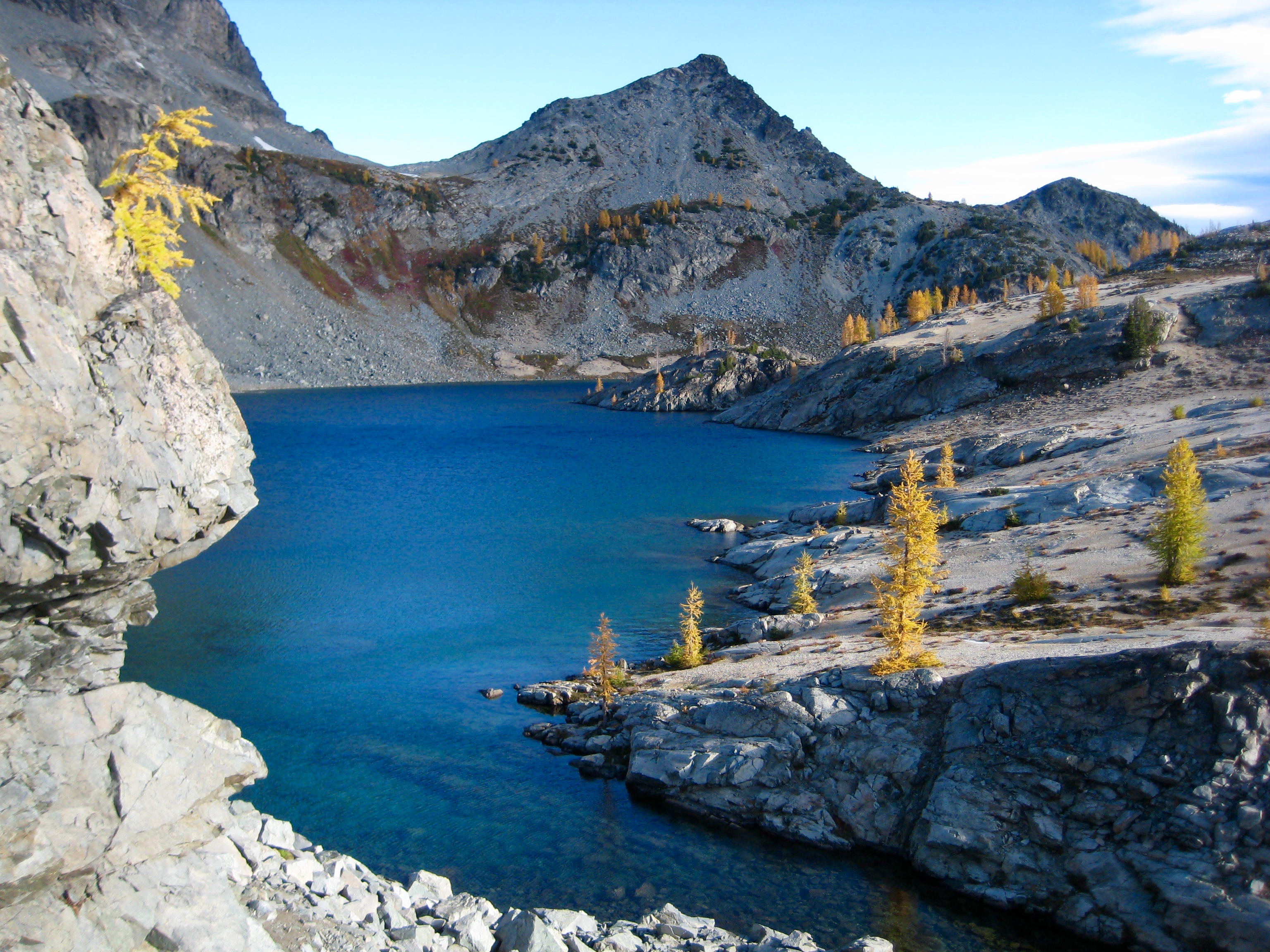 Upper Ice Lakes shoreline of rocky slabs and sporatic golden larch trees 