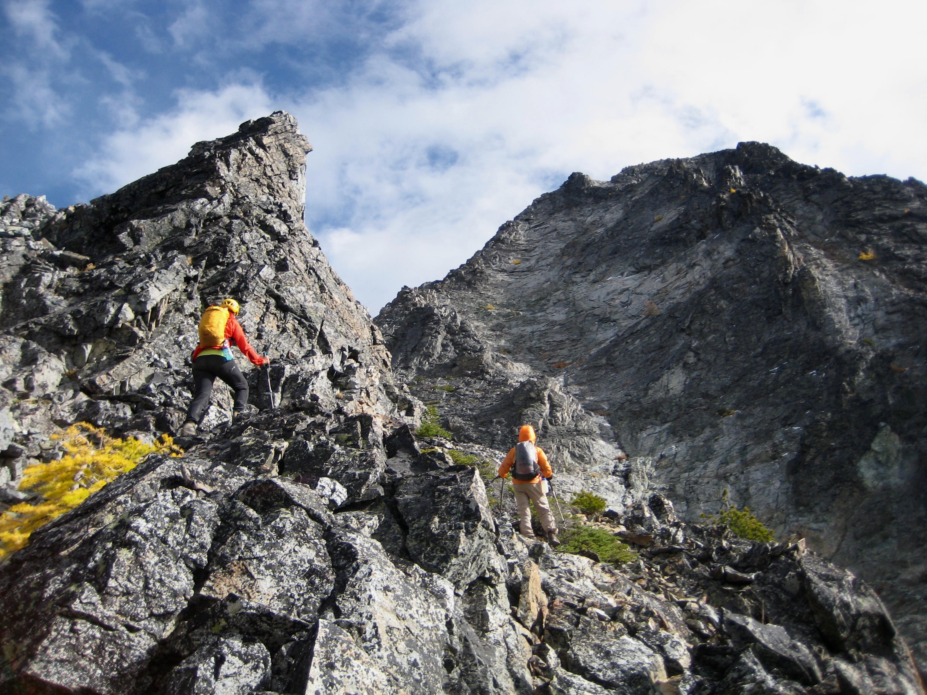 mountain climbers standing at an impasse on the rocky ridge of South Spectacle Buttte