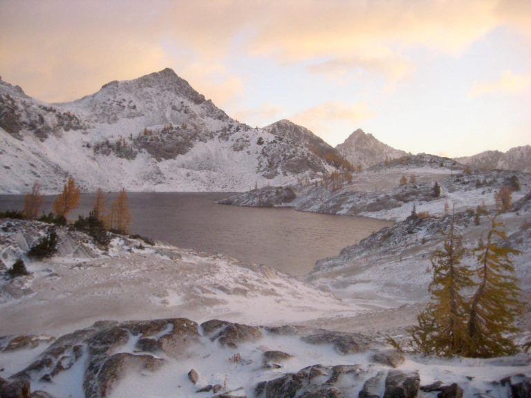 A snowy peak stands above Upper Ice Lake during Leroy-Carne Loop