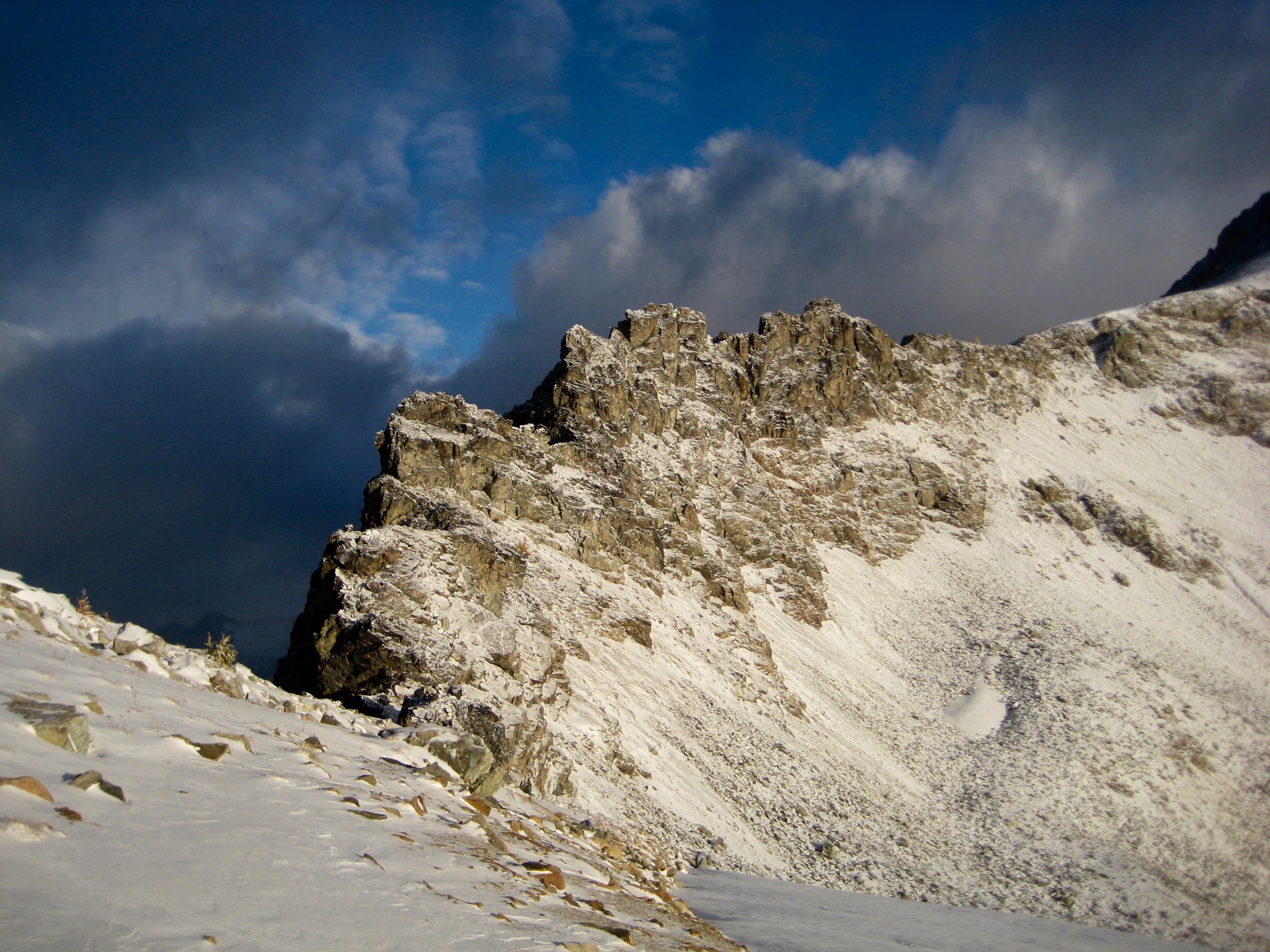 grey skies building over Freezer Pass above Ice Lakes in the Entiat Mountains
