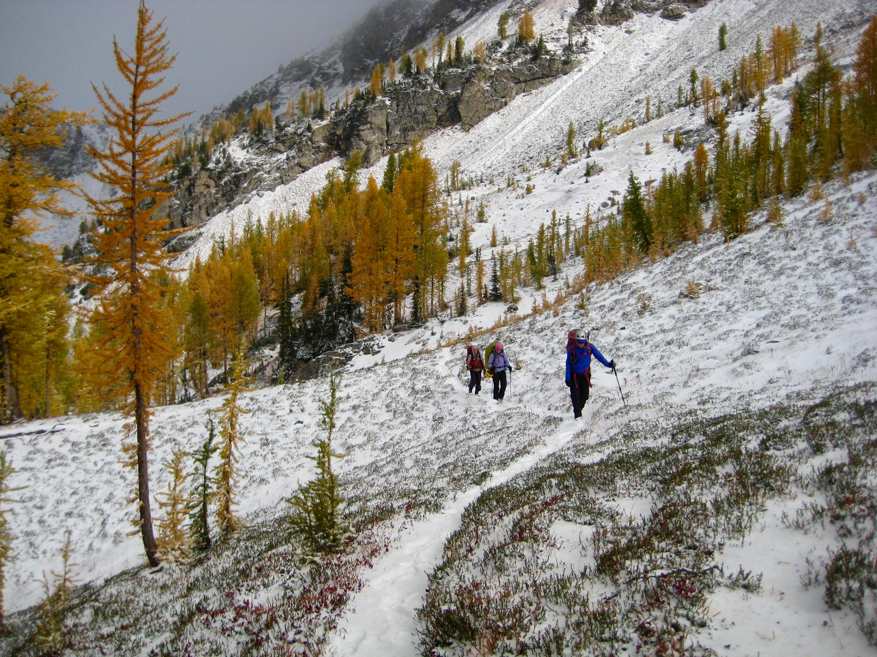 mountain climbers hiking through fresh snow on the way to Carne Pass in the Entiat Mountains