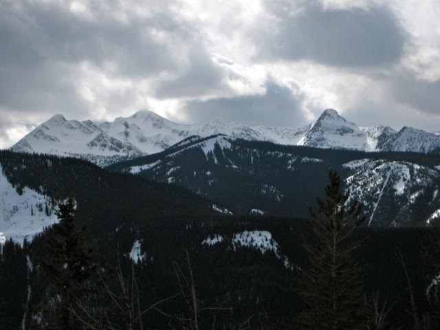 Stormy clouds swirl over Mt Winthrop as seen from Monument 83 ridge leading to the US-Canadian Border