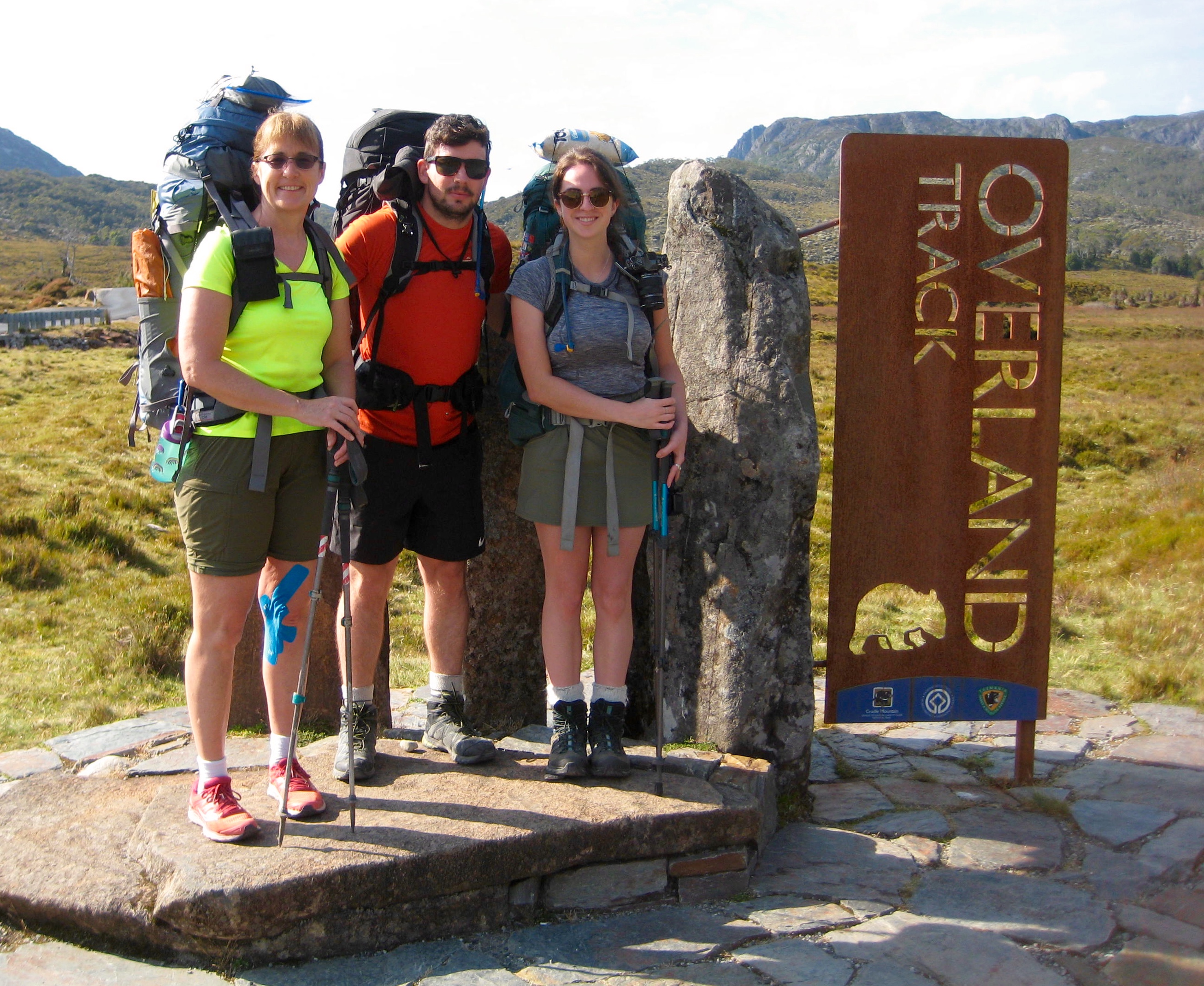 Hiking group at the start of the Overland Track with the Overland Track sign