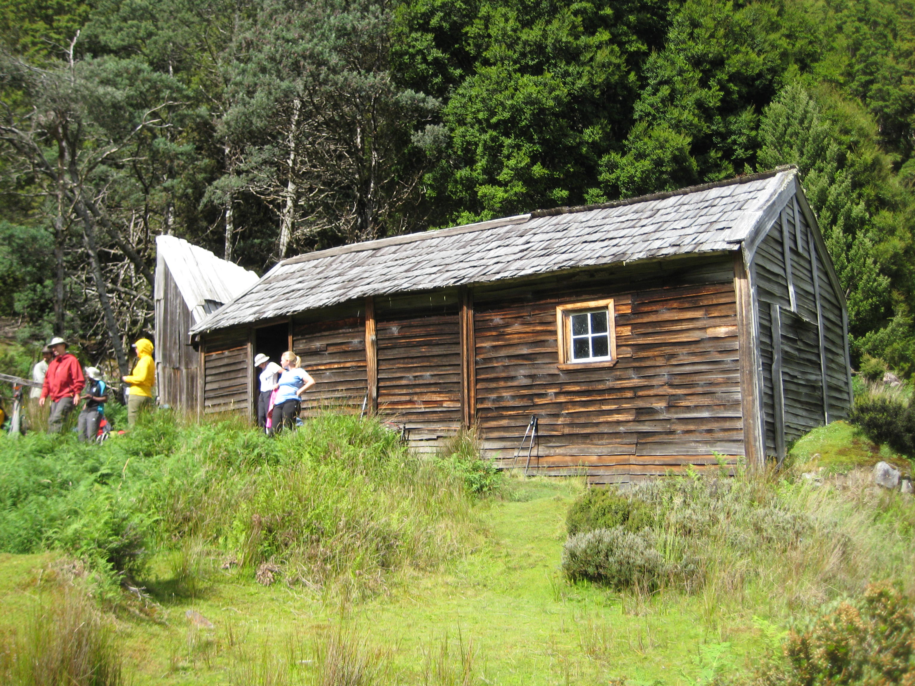 group of trekkers resting at Old DuCane Hut on the Overland Track