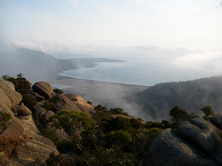 Hazard Beach forms a graceful curve as seen from the summit of Mt Amos in Tasmania's Freycinet National Park