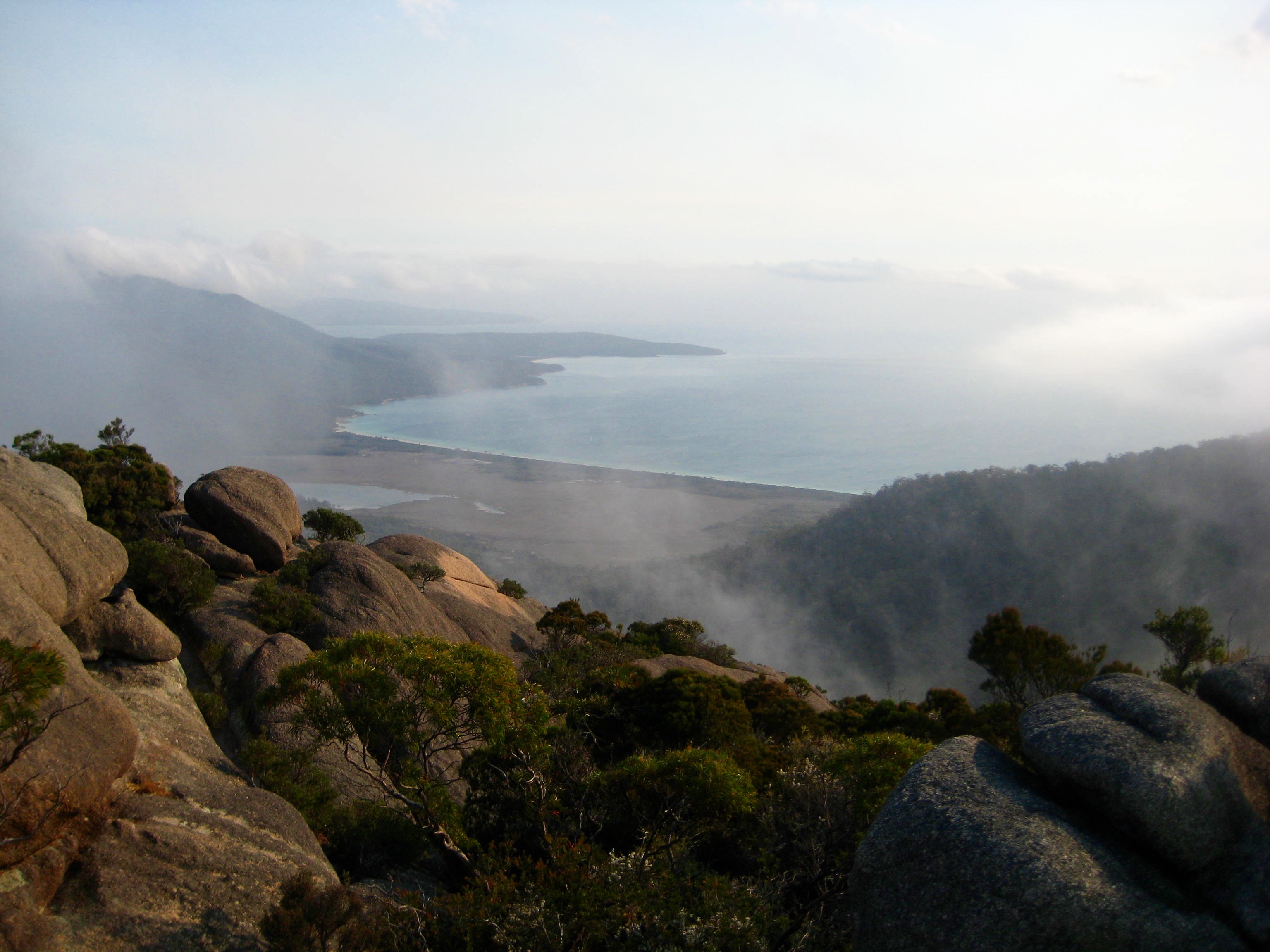 Hazard Beach forms a graceful curve as seen from the summit of Mt Amos in Tasmania's Freycinet National Park
