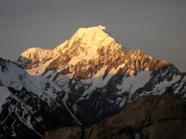Evening sun highlights Mt Cook viewed from Mueller Hut across a deep valley