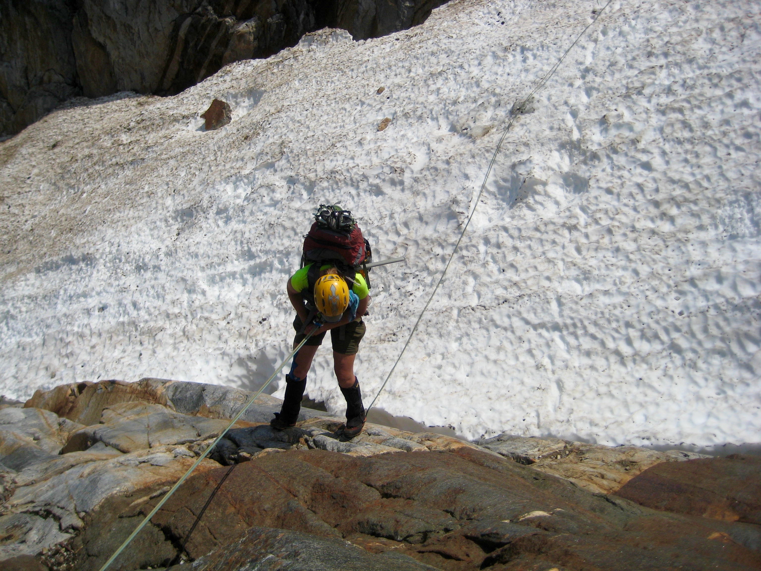 climber rappelling into snow gully below McMillan Glacier marking the low point of the Picket Traverse