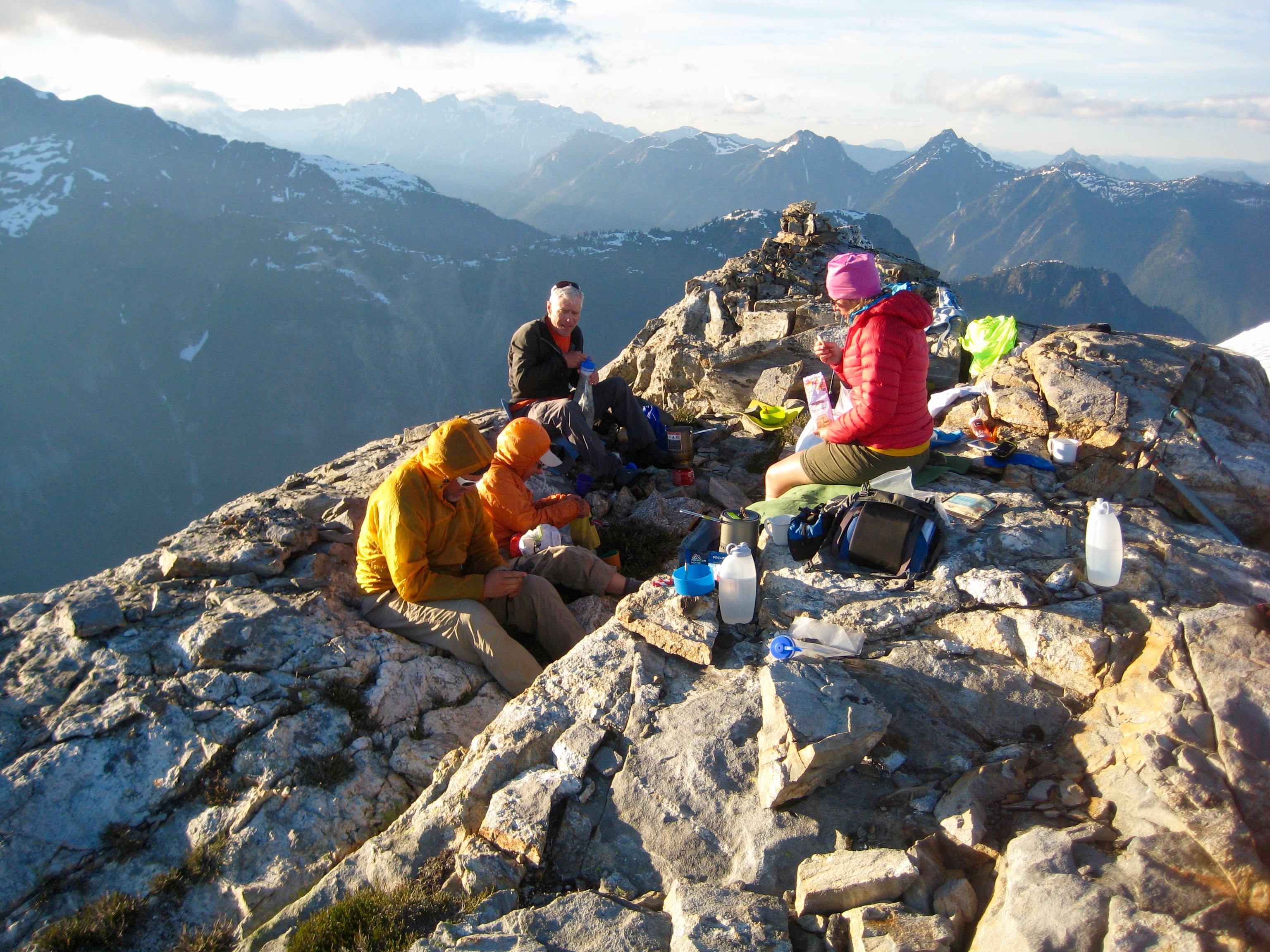 climbers celebrate completing the Picket Traverse on the summit of Rhino Butte