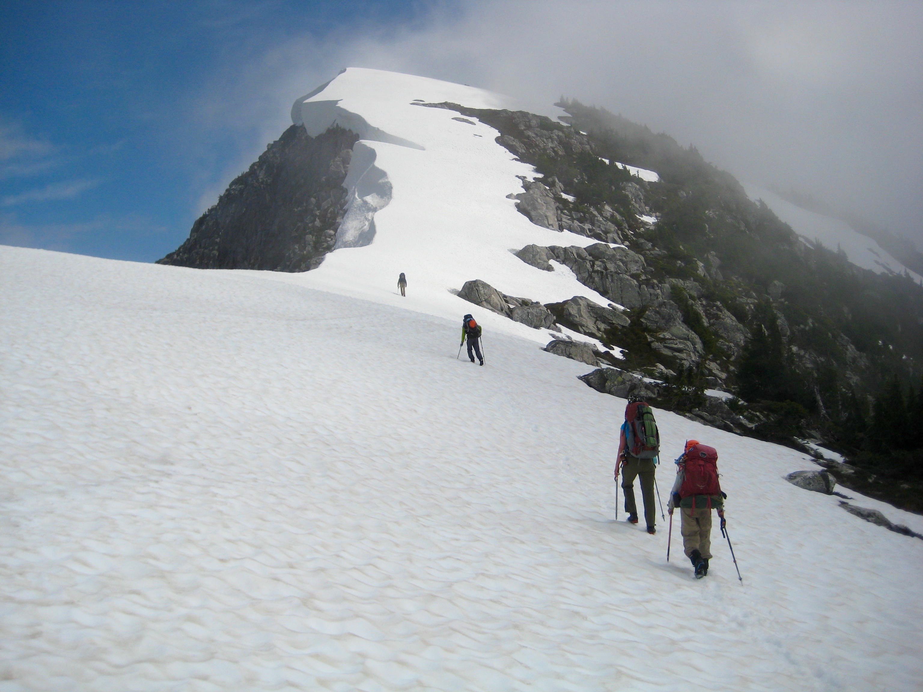 climbers ascending snow fields towards the summit of North Stetattle Butte