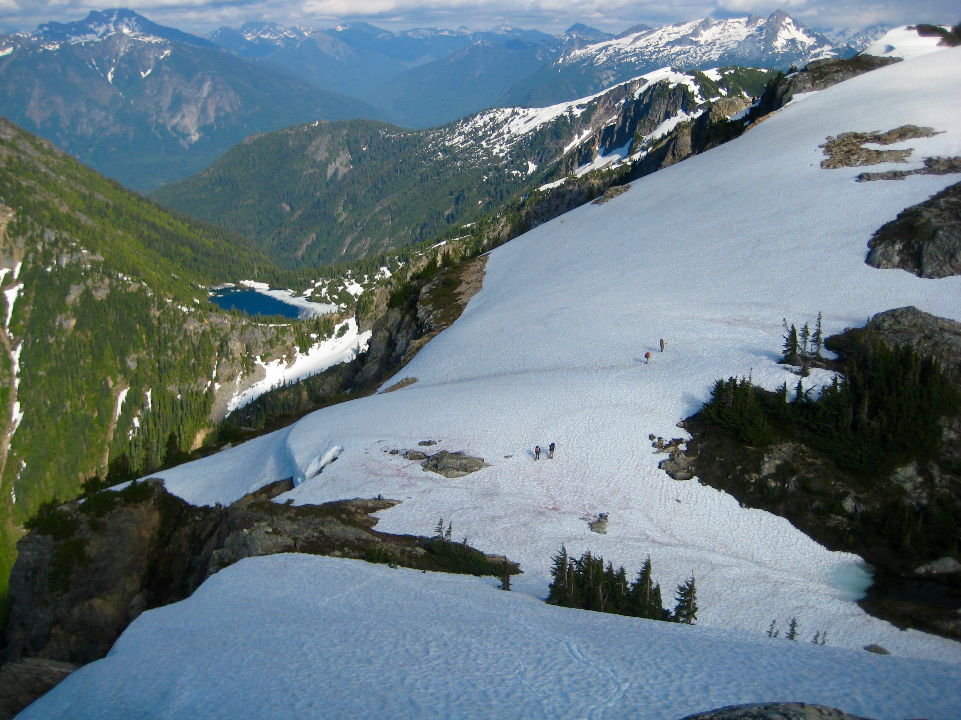 climbers descending snow field toward Stetattle Arm above Sourdough Lake