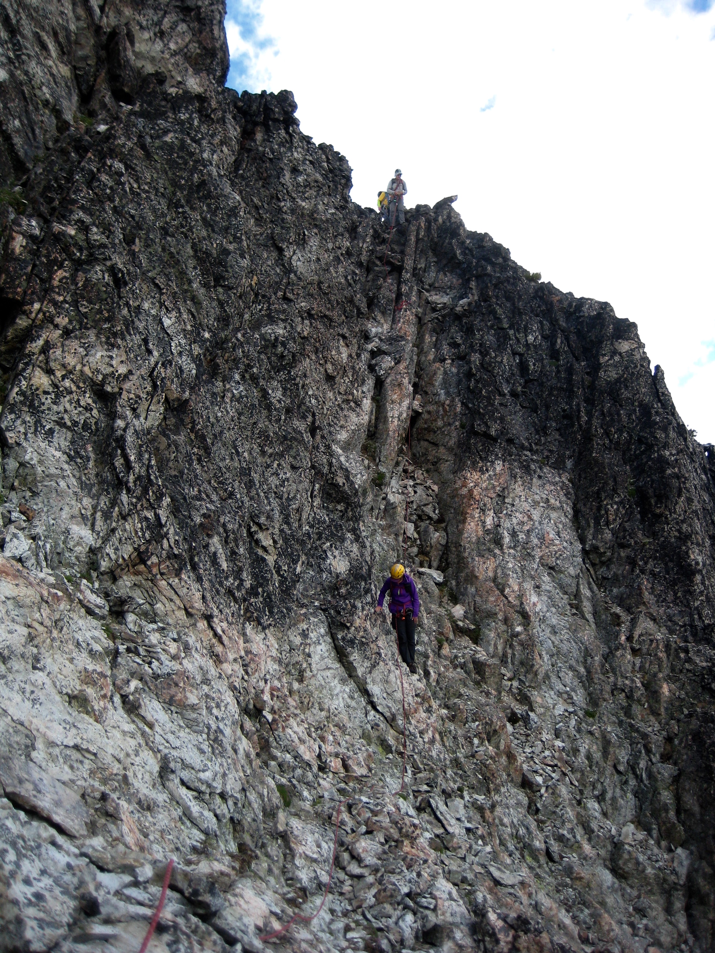 Mountain Climbers traversing below summit horn of Easy Mox Peak