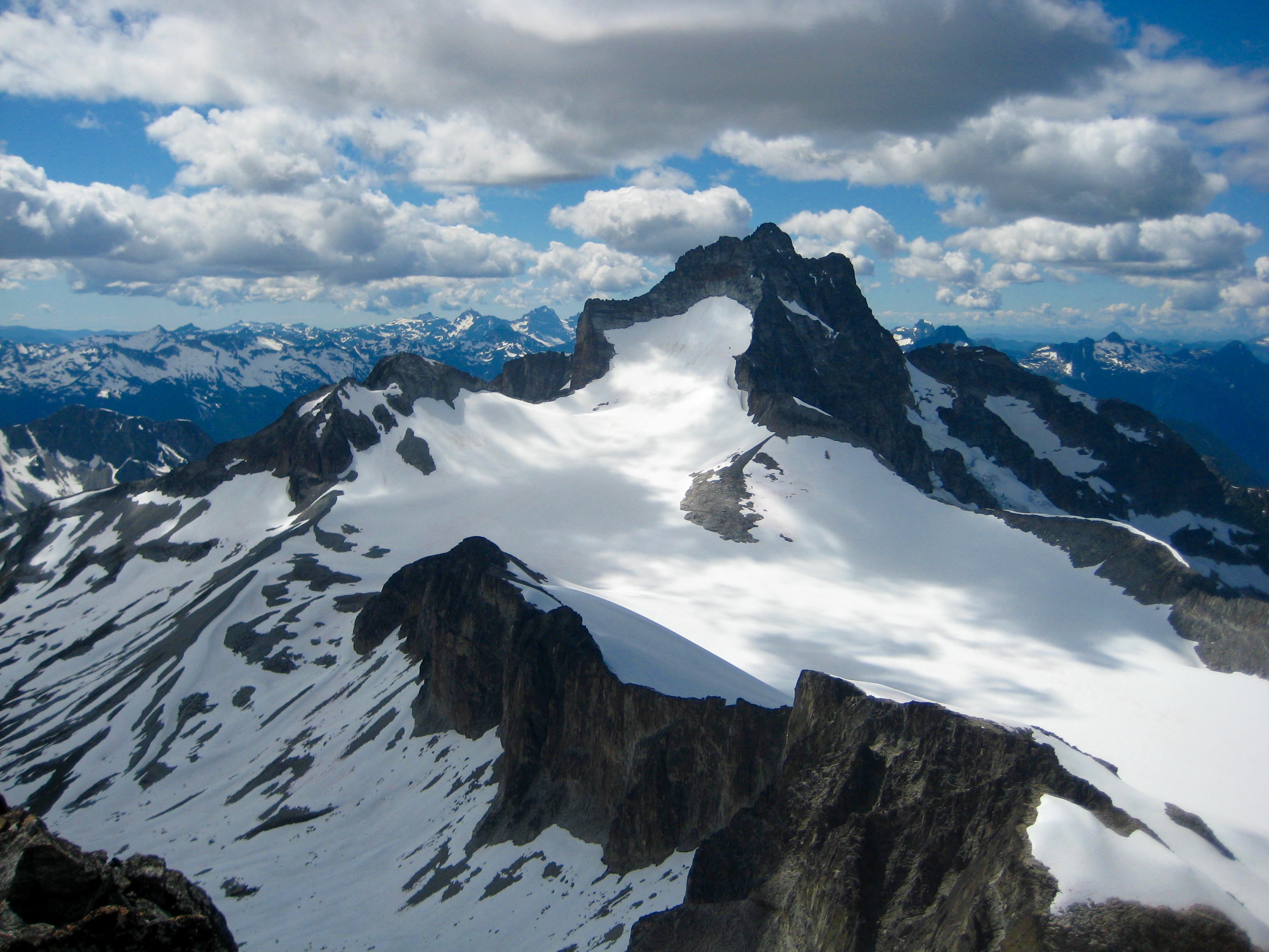 Mt Redoubt and the Redoubt Glacier with high clouds as seen from the summit of Easy Mox Peak in the American Chilliwack Mountains
