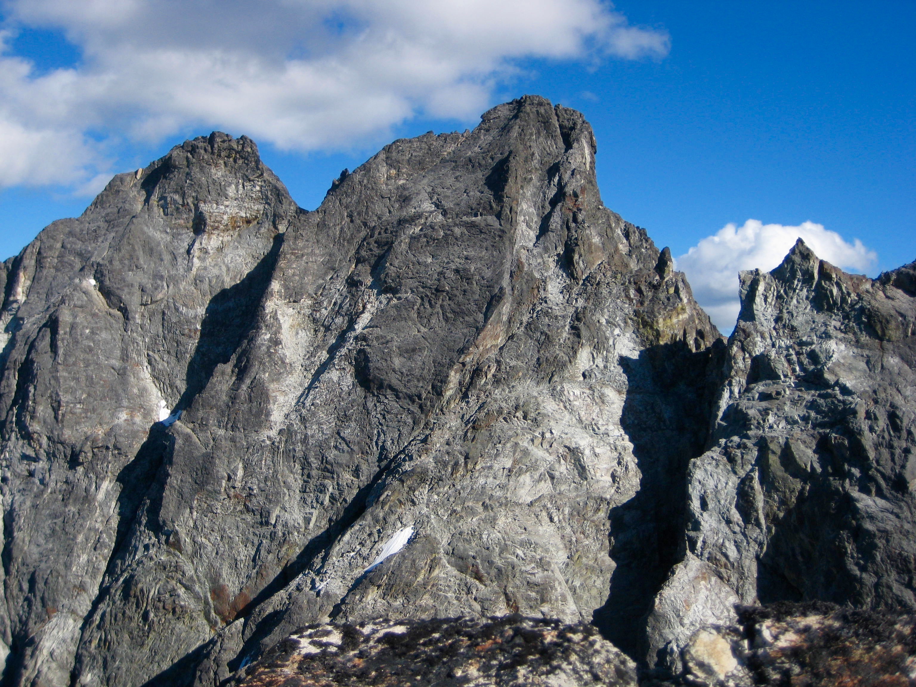rocky summit horn of Hard Mox Peak as seen from the summit of Easy Mox Peak in the American Chilliwack Mountains