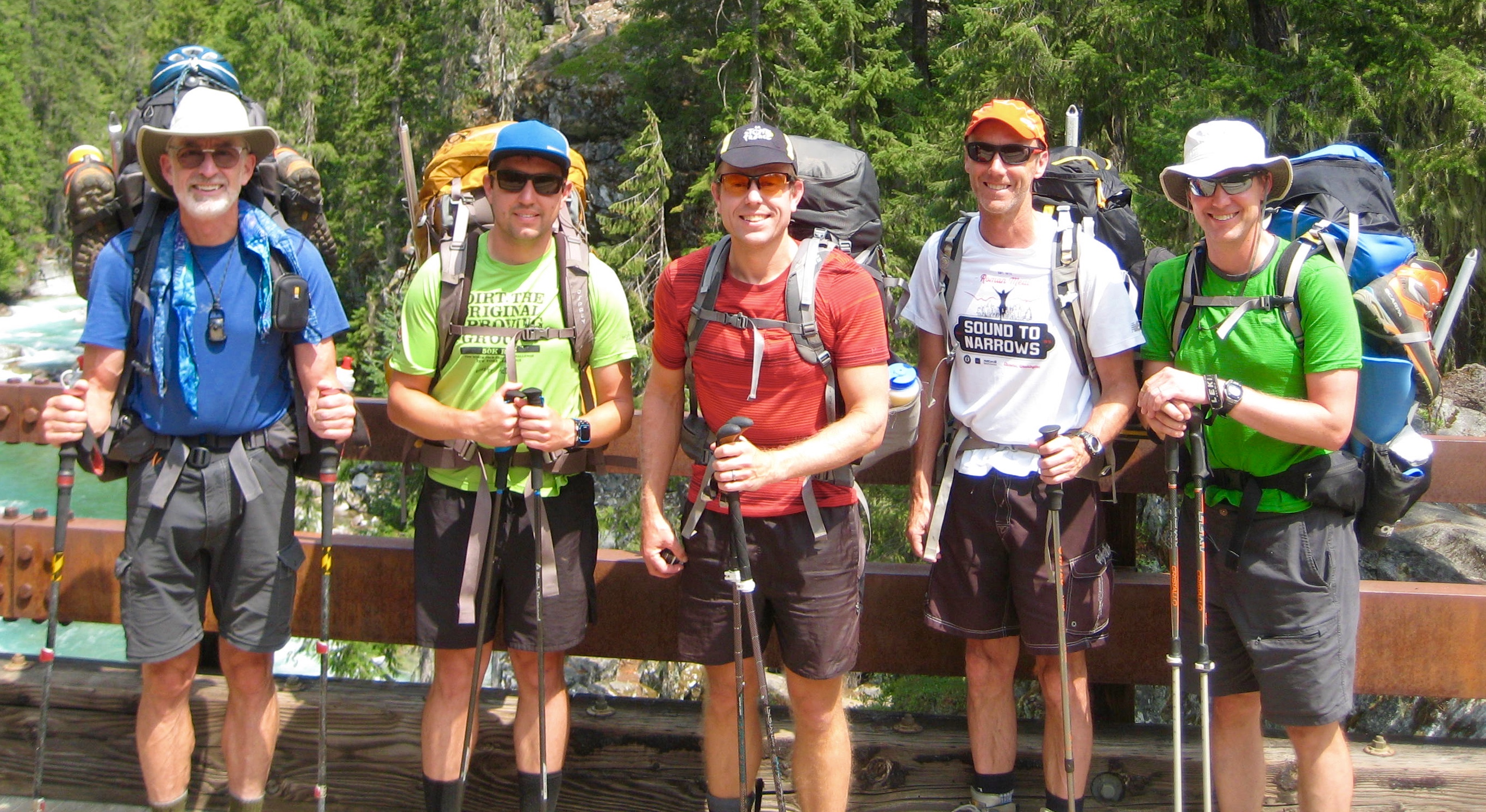 mountain climbers standin gon High Bridge near Stehekin in the North Cascades