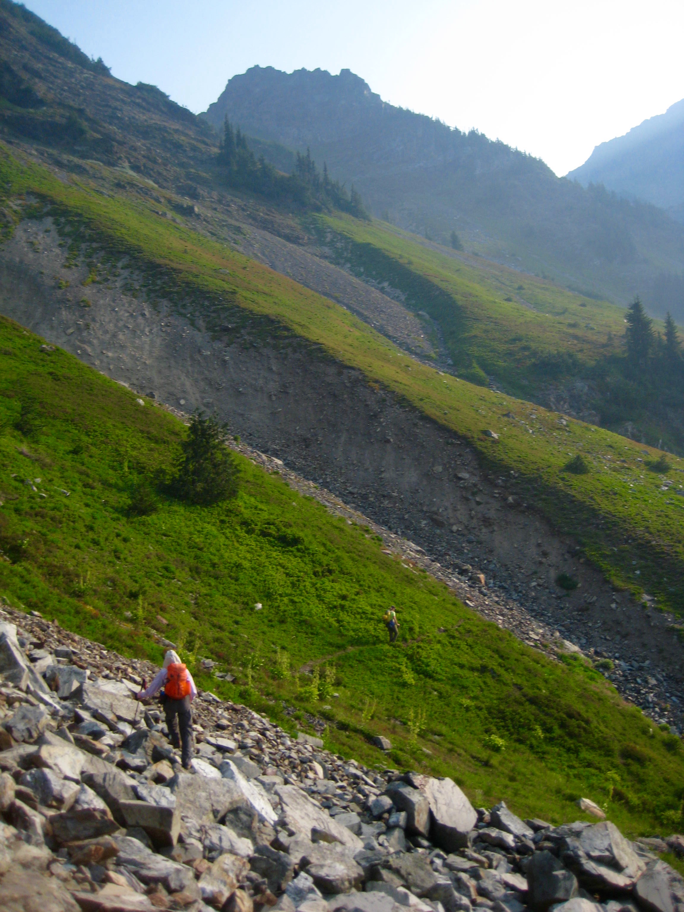 mountain climber traversing boulder field heading towards Baby Munday Creek in the Cheam Range