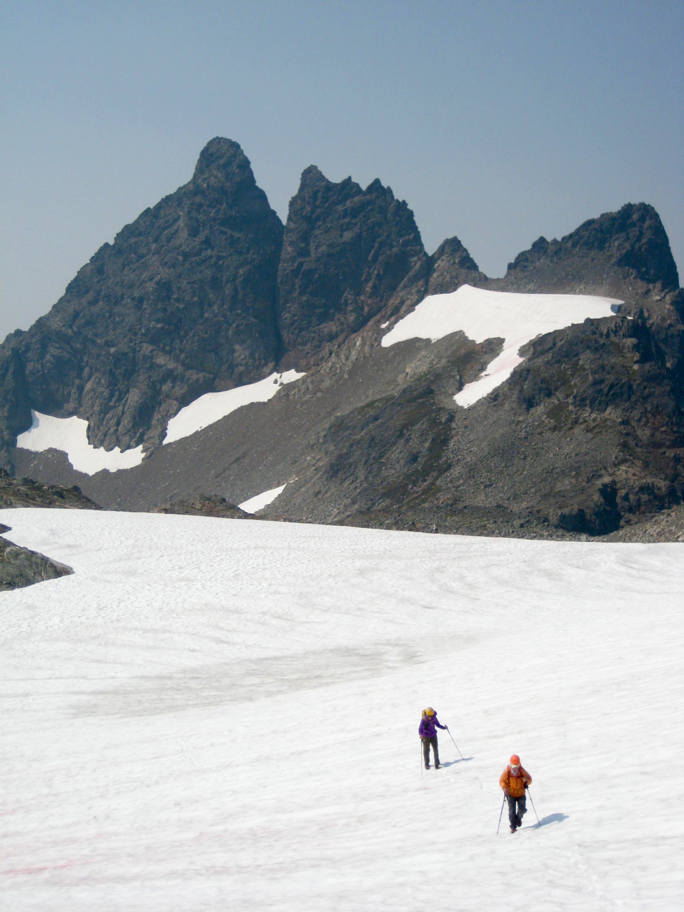 Baby Munday Peak with mountain climbers crossing the snowfield in the Cheam Range