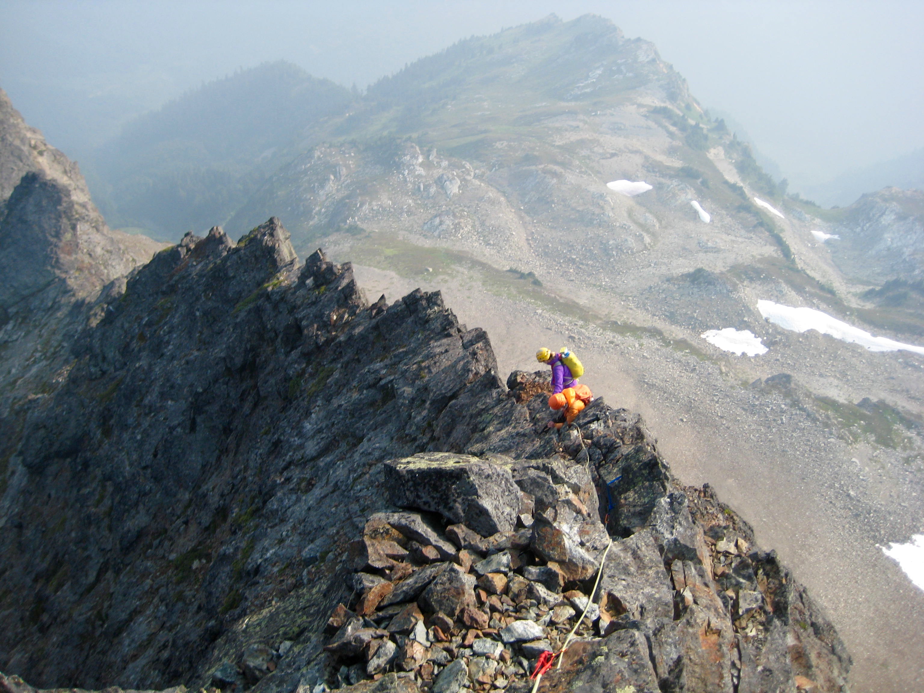 Climbers scrambling down the south ridge of Baby Munday peak