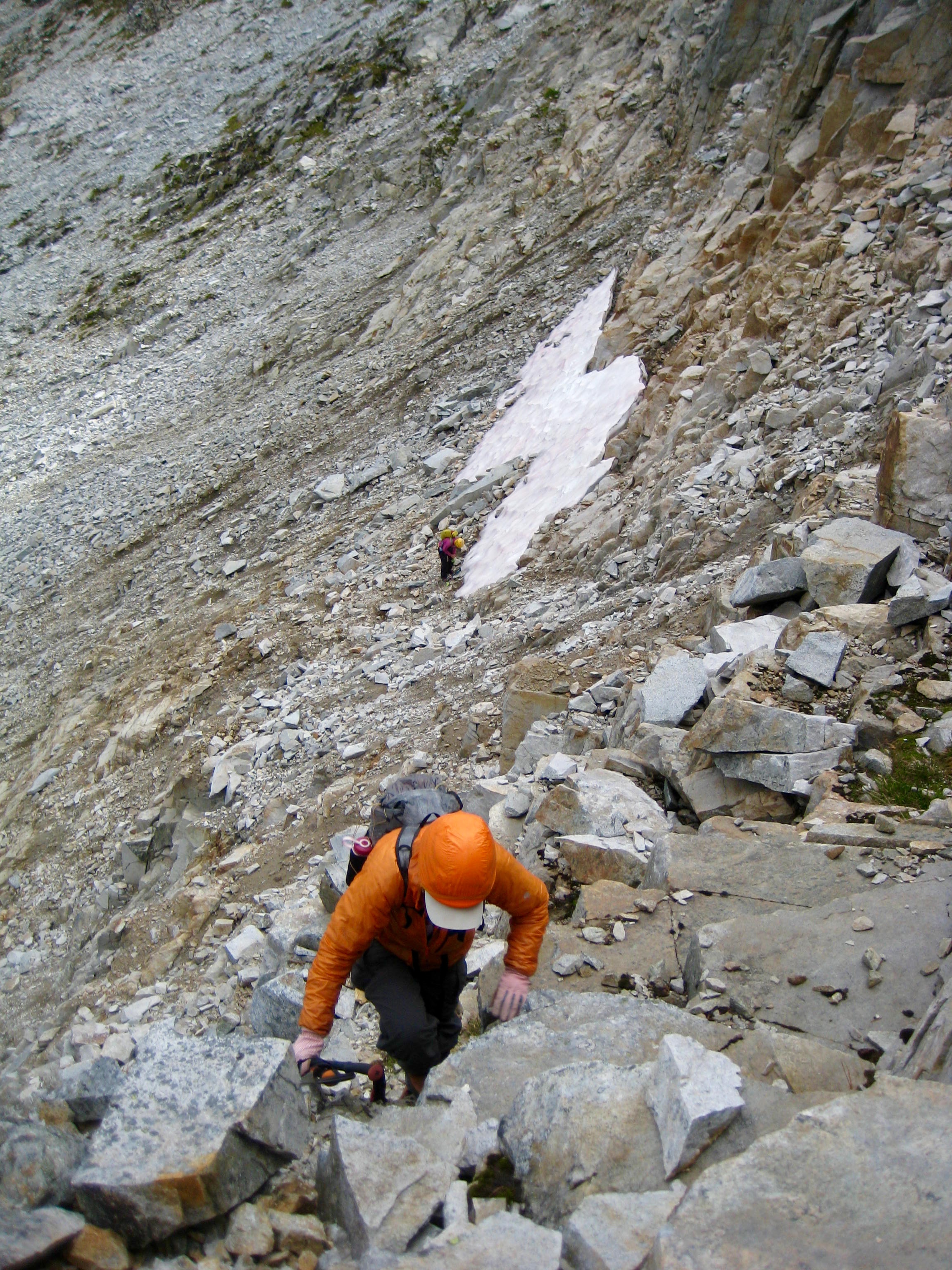 mountain climbers scrambling up rocky ramp on the West Ridge of Bear Mountain in North Cascades National Park