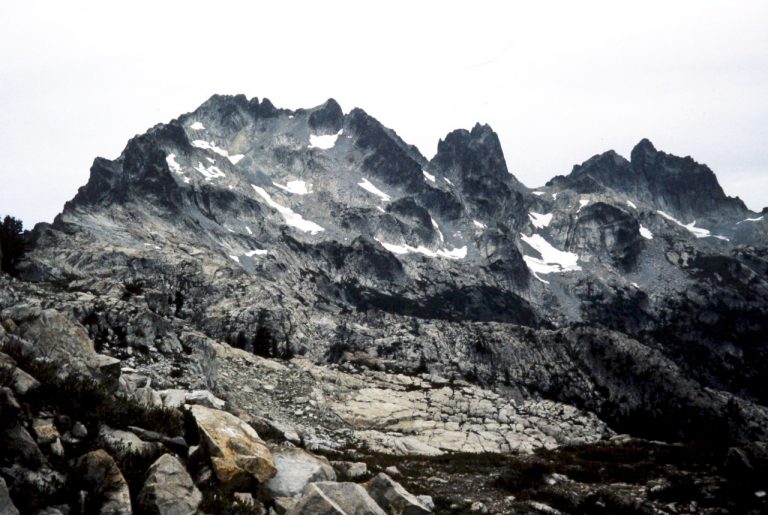 The rocky points of Summit Chief Mountain stand above Vista Ridge in the Snoqualmie Mountains