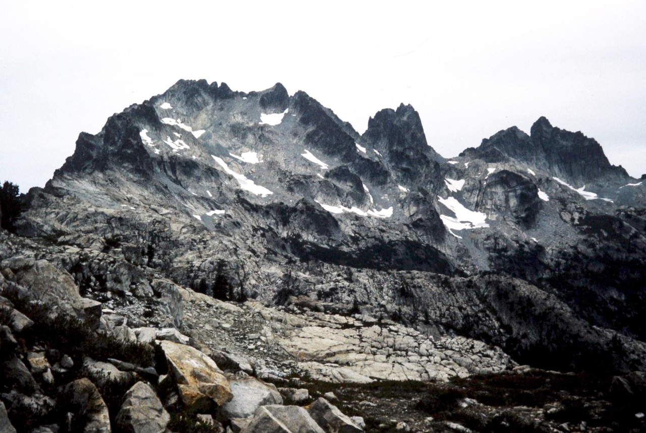The rocky points of Summit Chief Mountain stand above Vista Ridge in the Snoqualmie Mountains