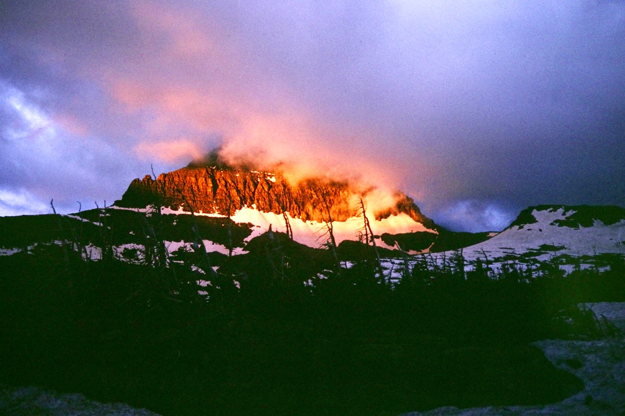 Morning alpenglow warms the east face of Clements Mountain