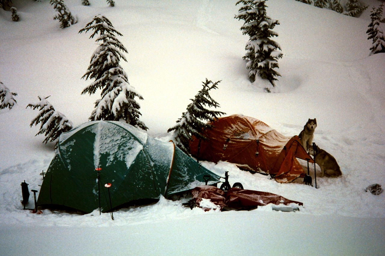 Two tents are covered with snow after a winter storm at Lake Valhalla