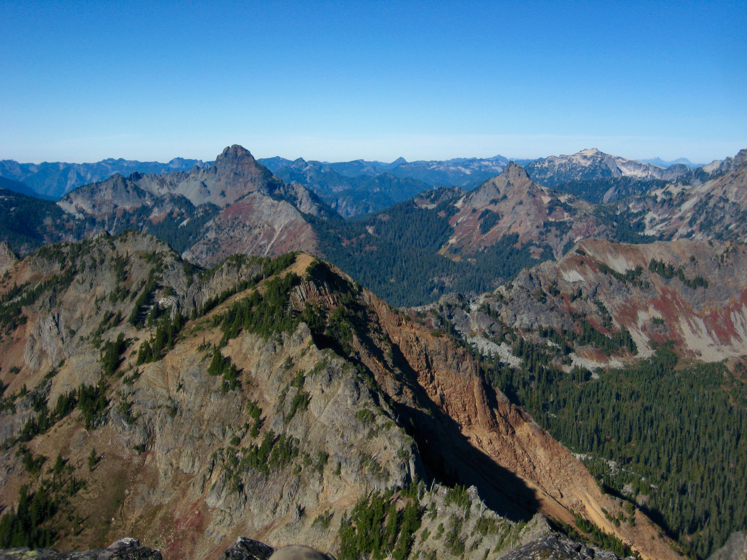 Mt Thomson and Huckleberry Mountain in the Alpine Lakes Wilderness as seen from Hibox Peak summit in the Snoqualmie Mountains