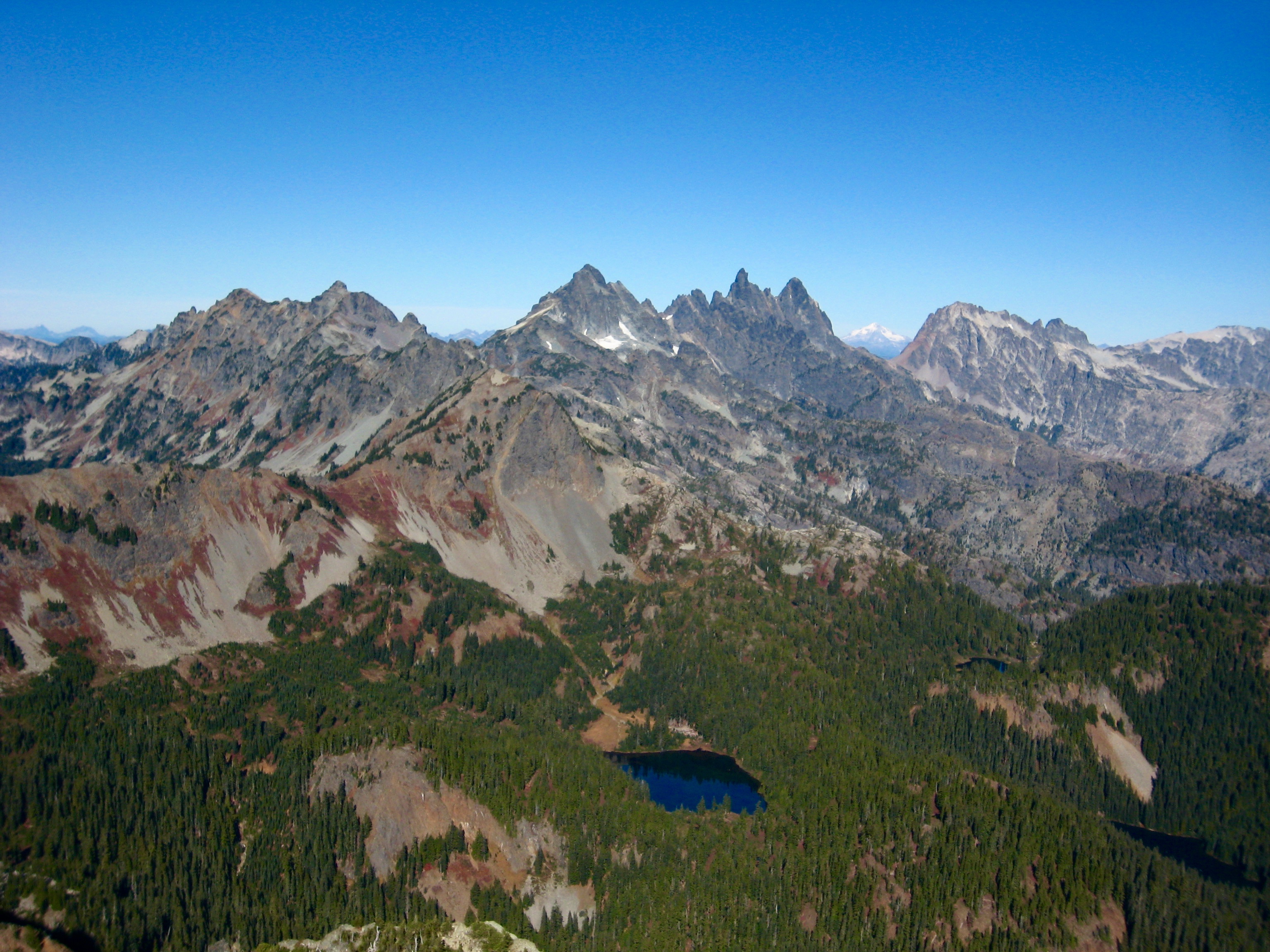 Chikamin Peak, Lemah Mountain, Chimney Rock, and Summit Chief Mountain in the Alpine Lakes Wilderness as seen from the summit of Hibox Peak in the Snoqualmie Mountains